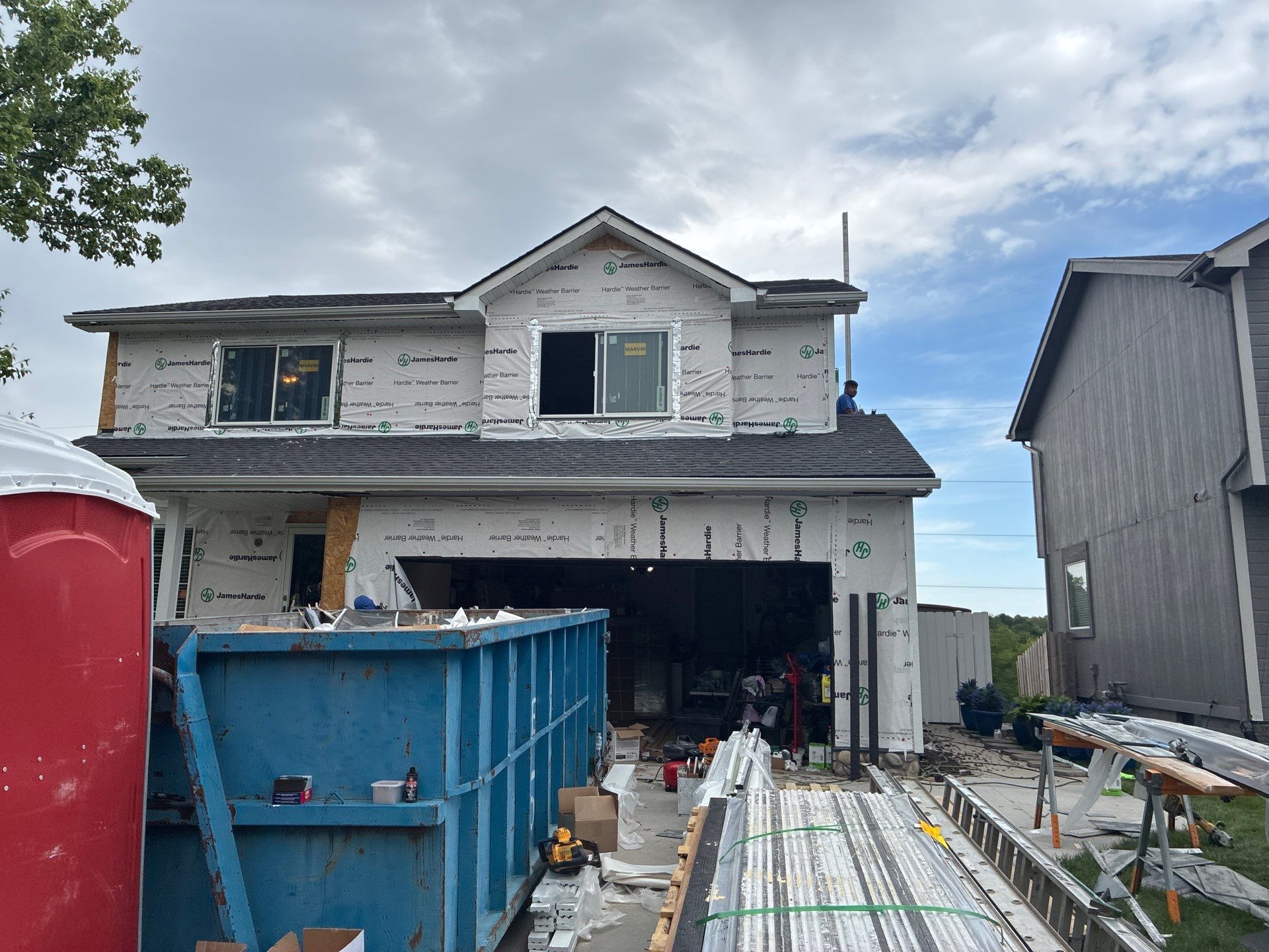 James Hardie Siding and Window Replacement with Arctic White Trim by Carps Complete Exteriors