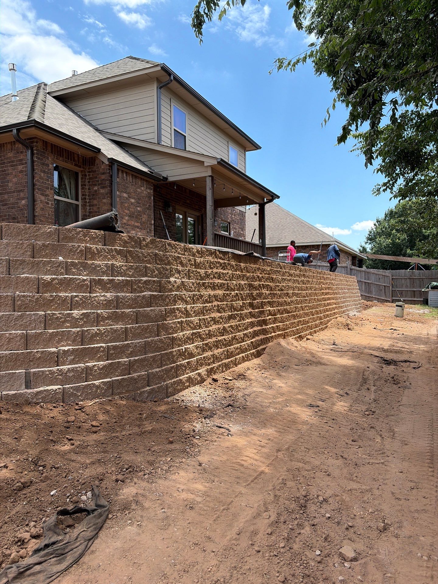 Custom Segmental Block Retaining Wall and Sod Installation in Lawton by Clays Services Inc