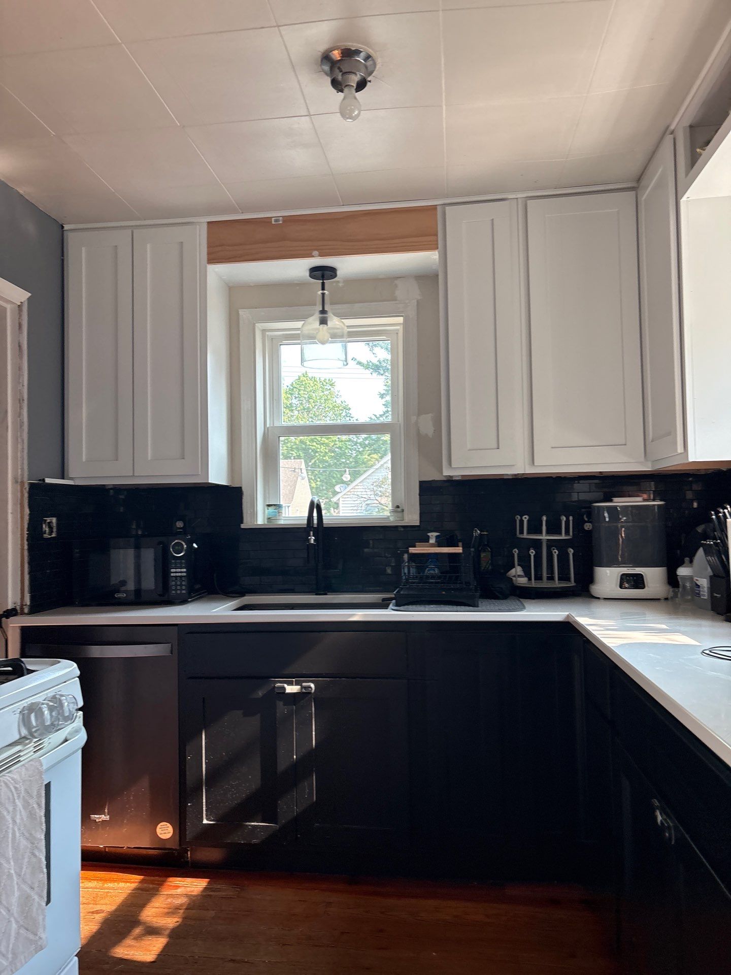 Lincoln Kitchen Remodel With Black and White Two-Tone Cabinetry by CompanyCam Sales Demo