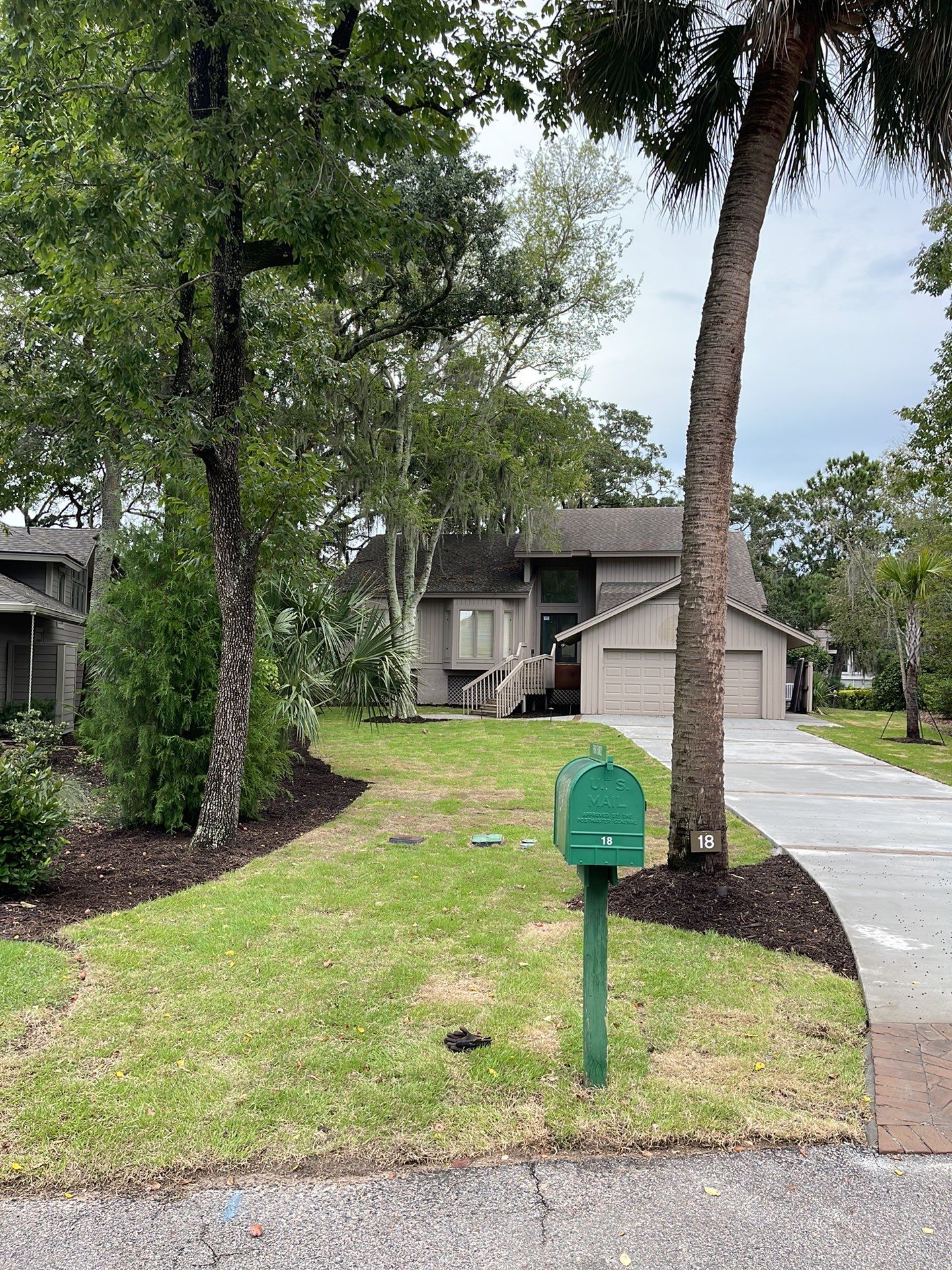 Concrete Driveway Replacement with Brick Paver Accents in Hilton Head Island by Lowcountry Scapes, LLC
