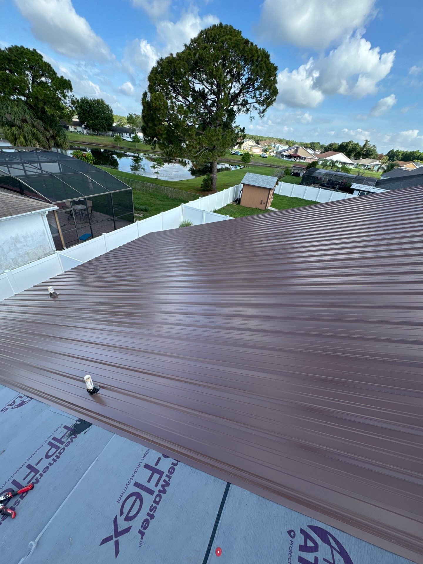 Residential Metal Roofing Installation and Gutter Replacement in Kissimmee by Pinnacle Roofing Group