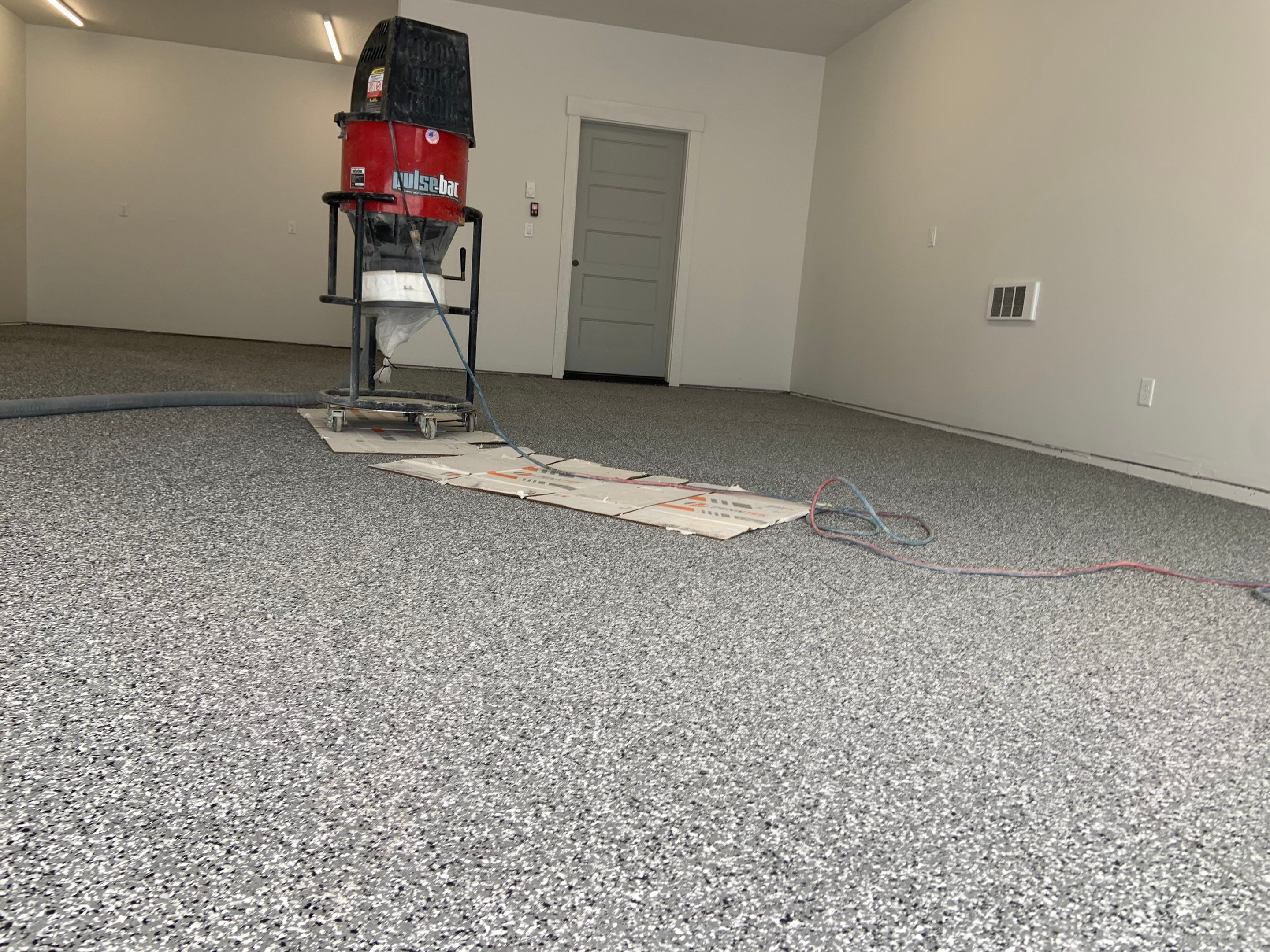 Garage Transformation using Smoke by Croc Coatings, LLC