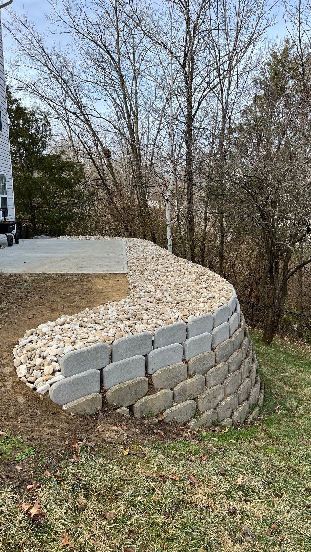 Above Wall Decorative Rock Bed by Reisenberg’s Lawn & Landscape, LLC