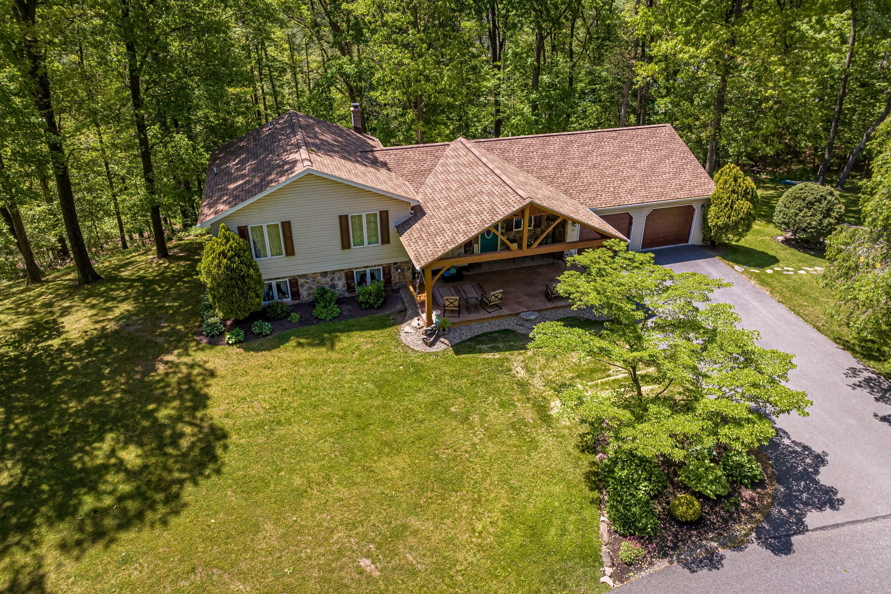 Reshingle-shakewood and timberframe patio roof by Esh Builders