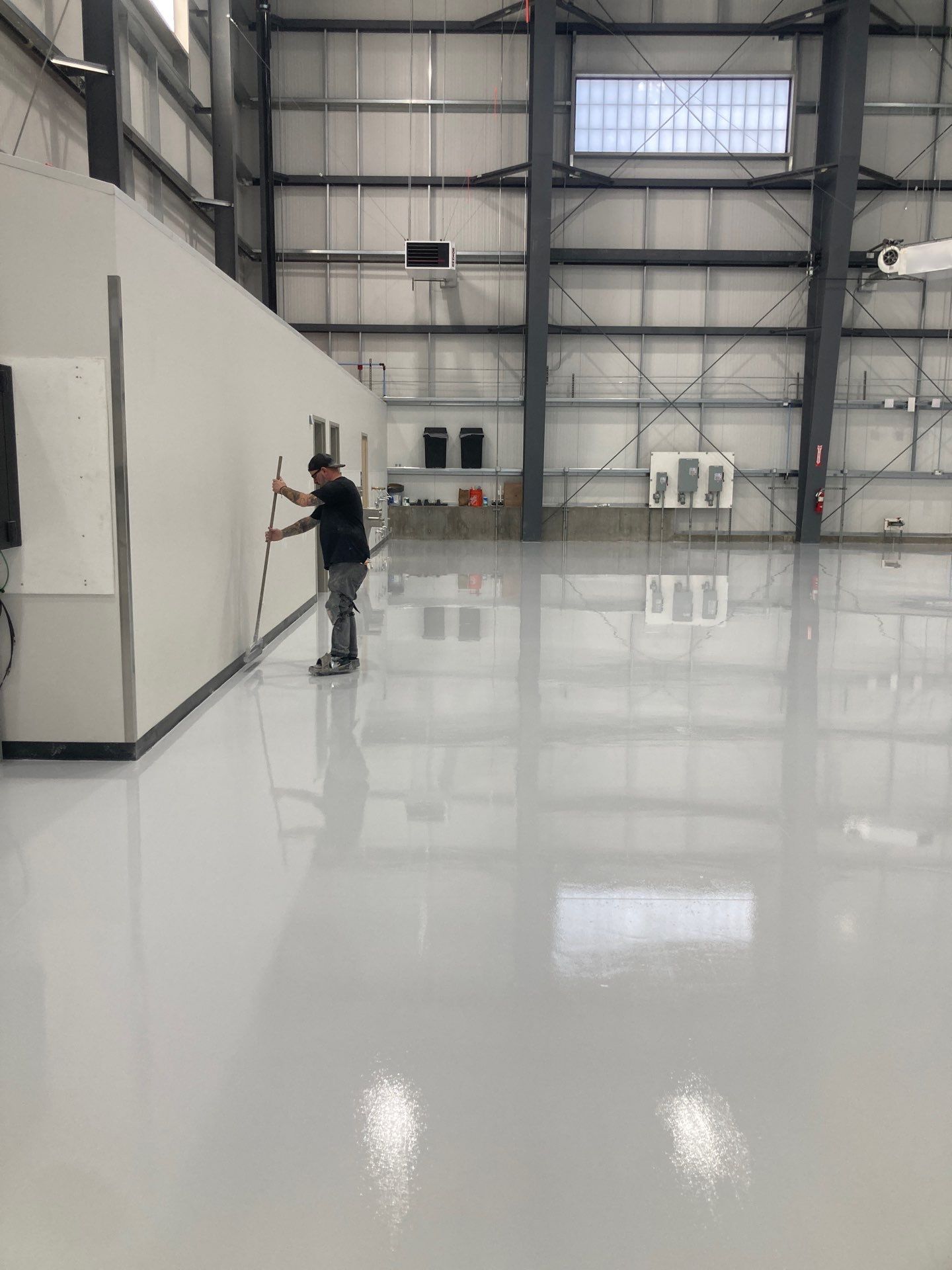 Airplane Hanger using Light Grey Commercial Penntek Epoxy by Croc Coatings, LLC