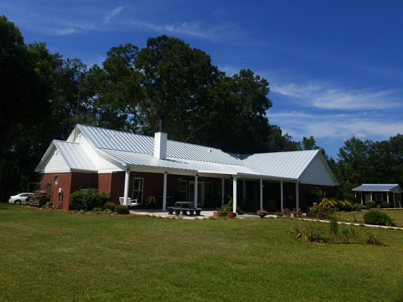 Residential Roofing Installation using Metal roofing by American Roofing & Construction LLC