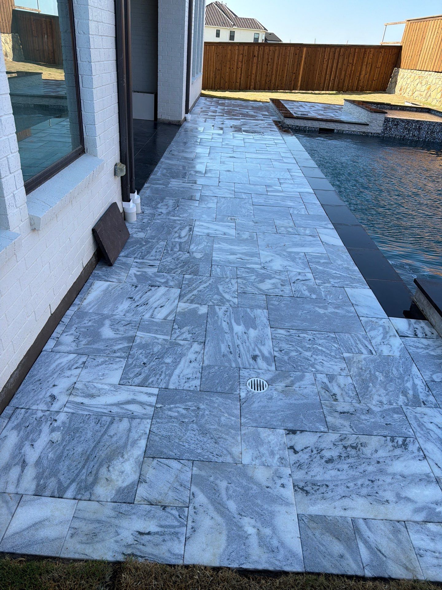 Modern Geometric Pool with Raised Spa and Marble Deck by Pinnacle Pools and Spas - DFW