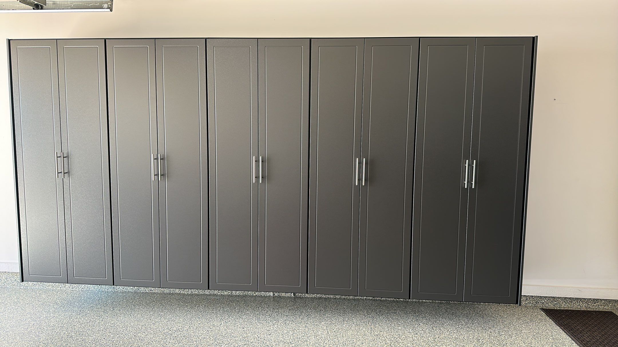 Lori H. upgrade her garage with cabinets and overhead racks by Banner Garage