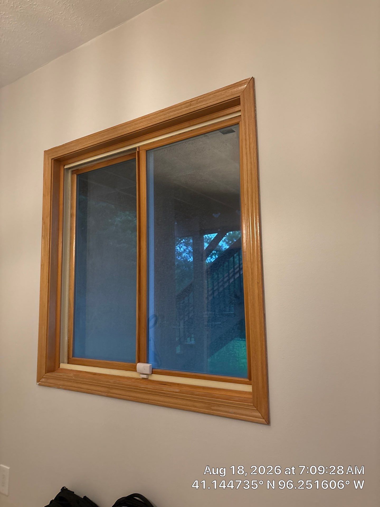 Residential Window Installation Featuring Natural Wood Frames in Gretna by CompanyCam Sales Demo