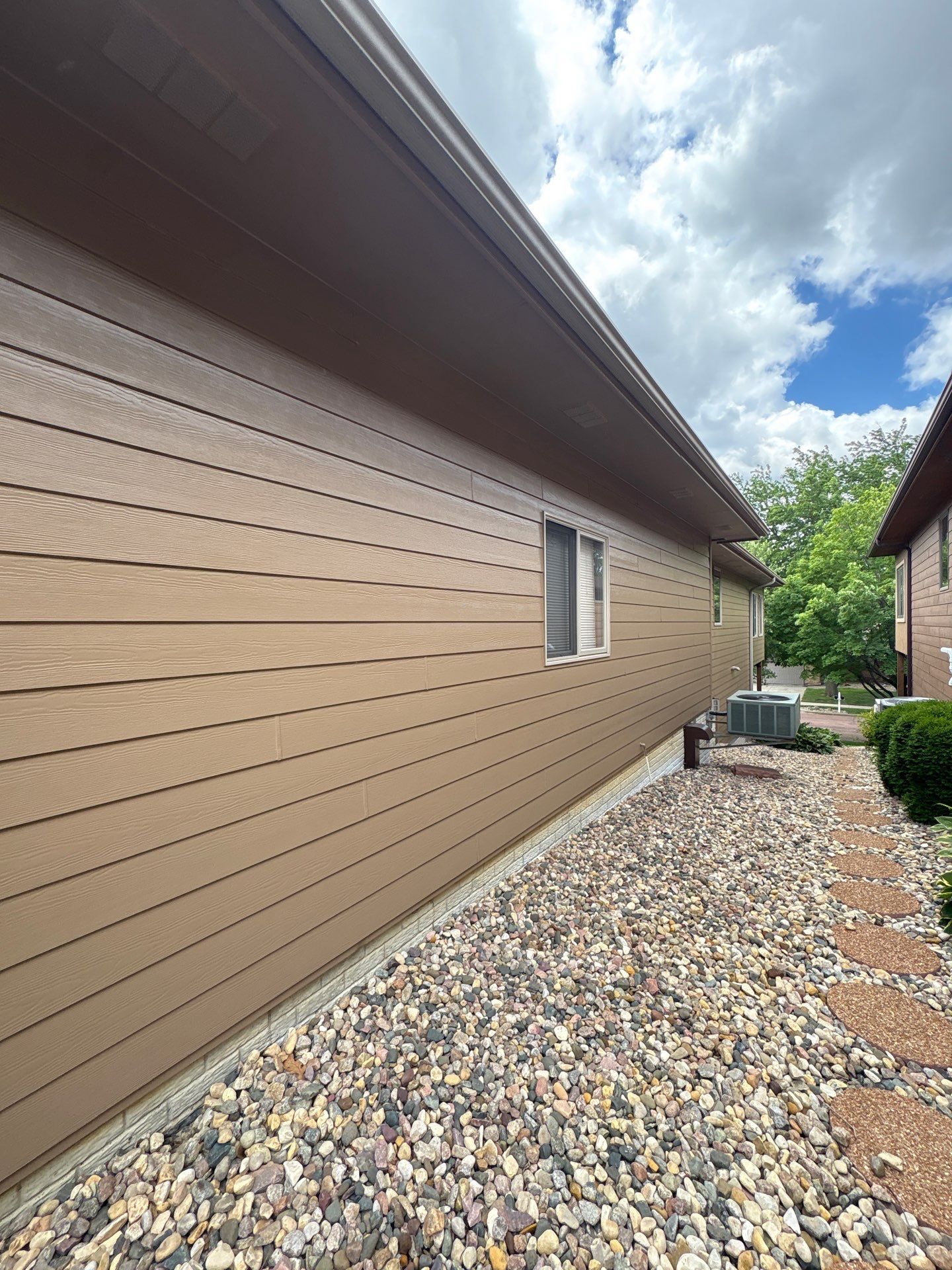 Multi-Story Residential Exterior Painting and Siding Refresh in Sioux Falls by Select Painting, Coatings & Garage Cabinets