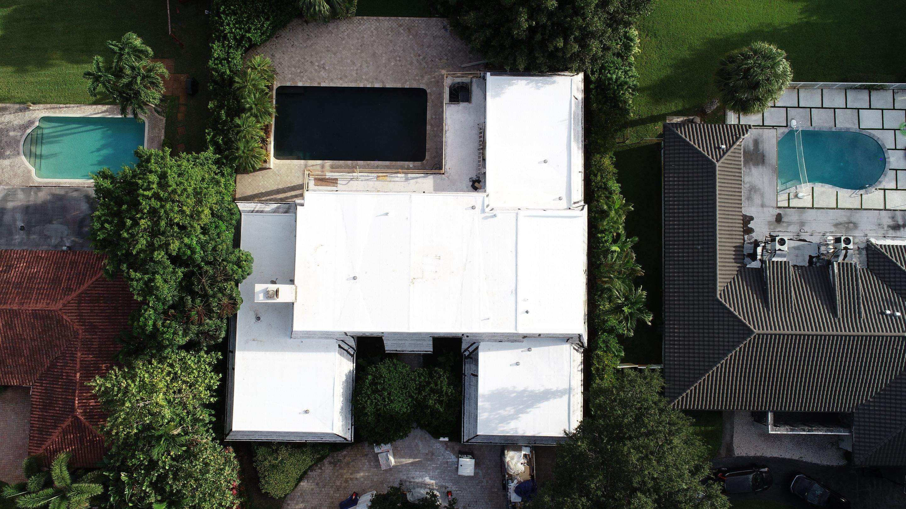 Amazing TPO flat deck re-roof with Eagle mansard in Hollywood Florida.  by First Due Roofing