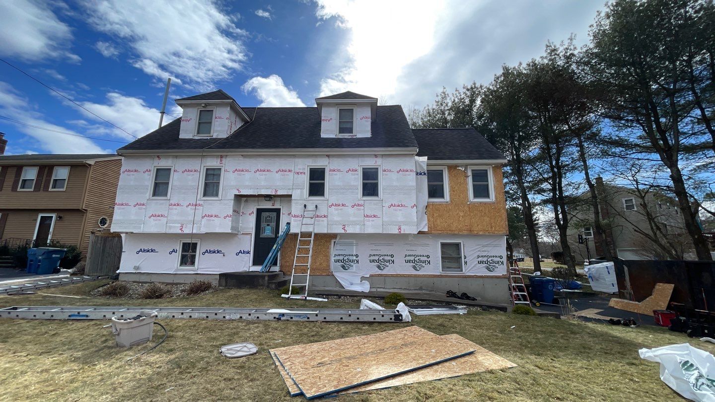 Complete Exterior Renovation with New Siding & Gutters   by Sensible Home Solutions