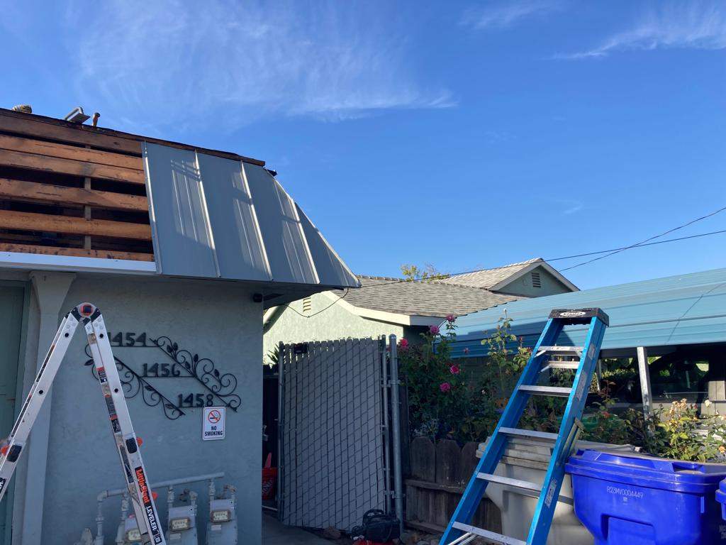 Foam Refurbish using Conklin Benchmark/PUMA XL coatings and spray foam; Also metal roofing around parapet wall by Straight Edge Roofing Inc
