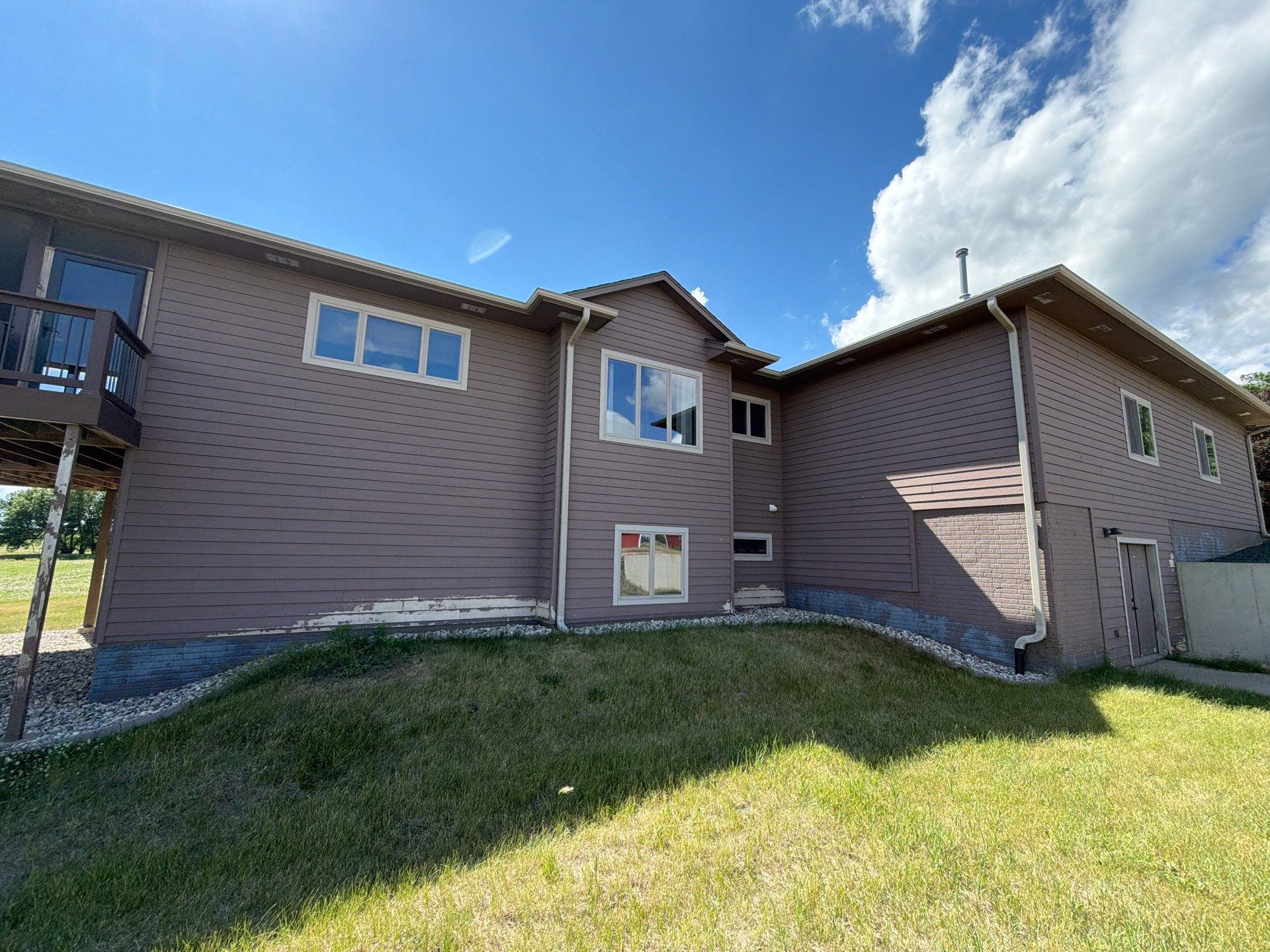 Full Exterior Siding Paint Restoration and Refresh in Garretson by Select Painting, Coatings & Garage Cabinets