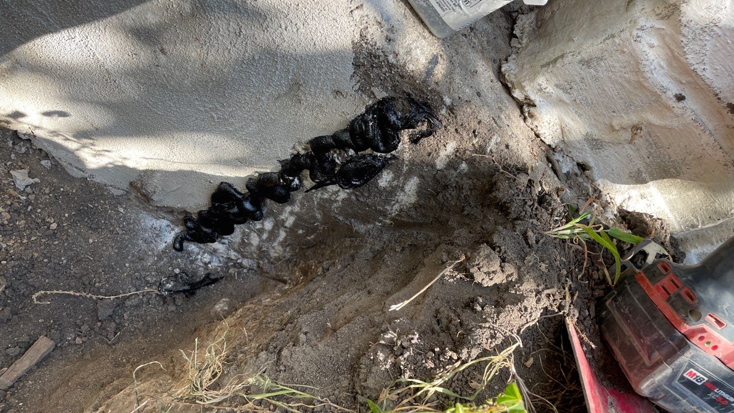 Drain Tile, Window Wells & Buried Discharge in Minneapolis by Waterproofing Northeast