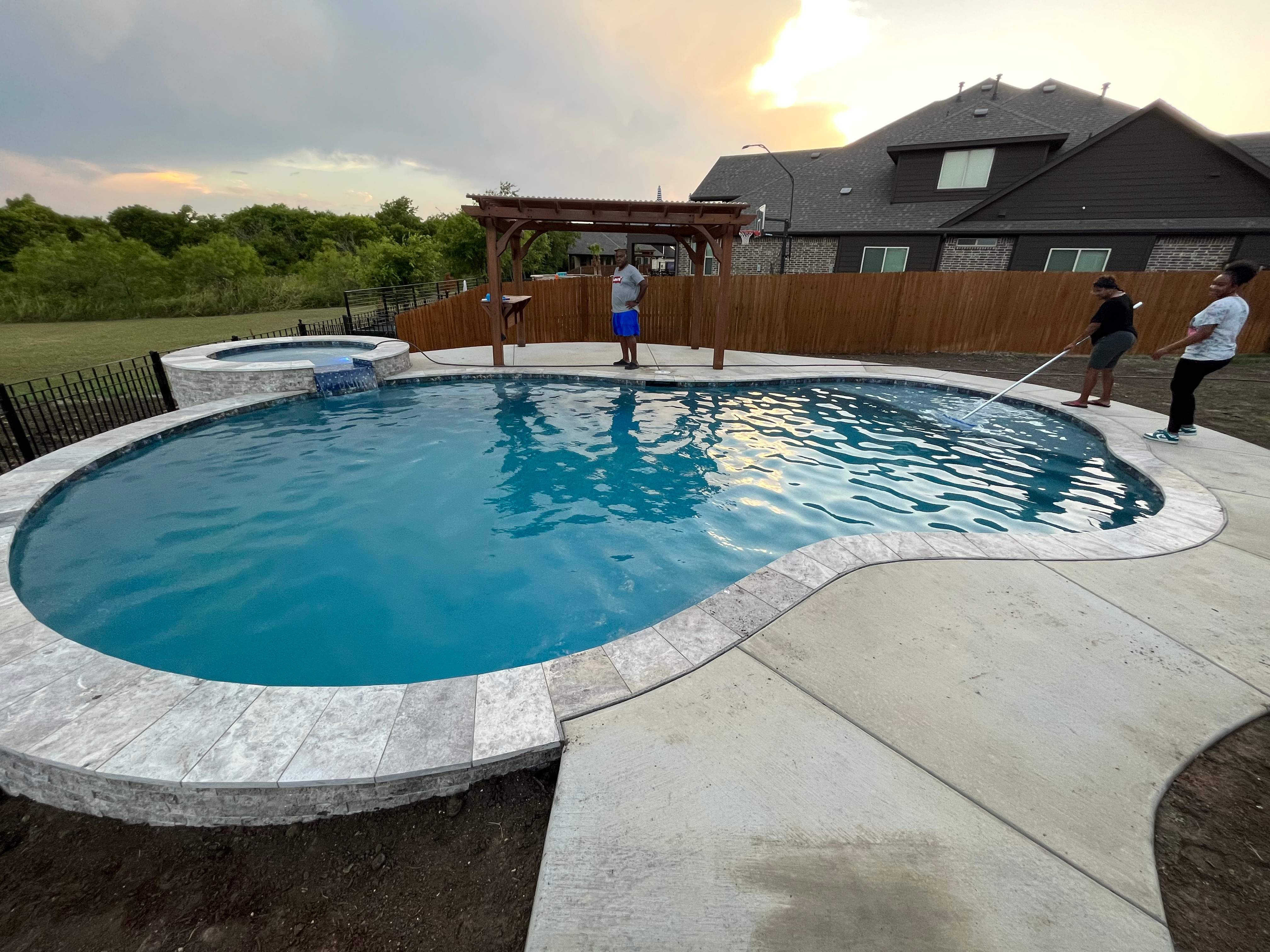Freeform Pool with Tanning Ledge by Pinnacle Pools and Spas - DFW