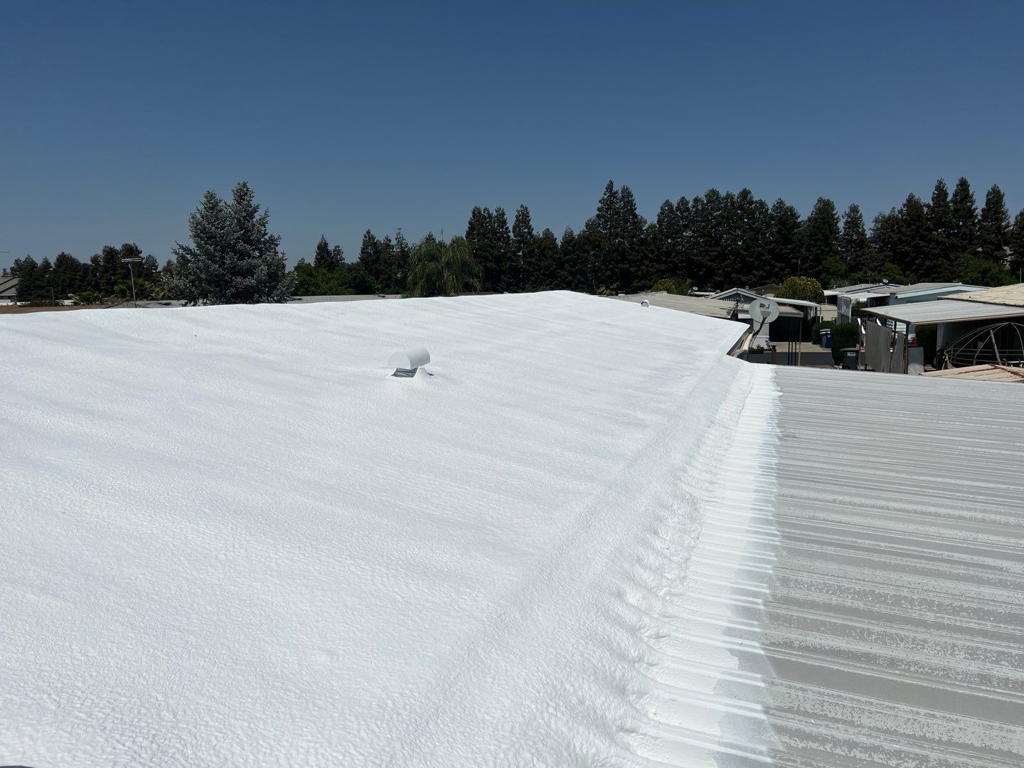 Spray foam and coatings using General Coatings acrylic coatings and spray foam by Straight Edge Roofing Inc