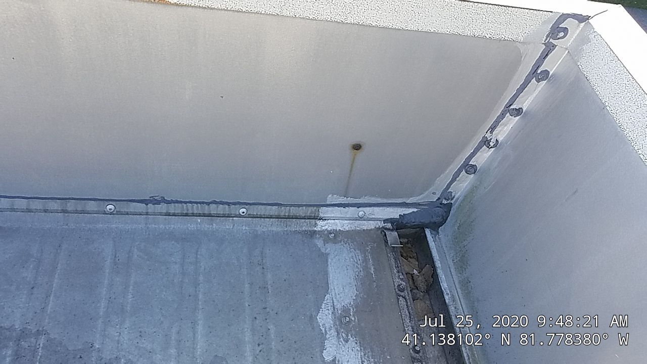 Commercial Metal Roof Coating by Gold Star Roofing LLC