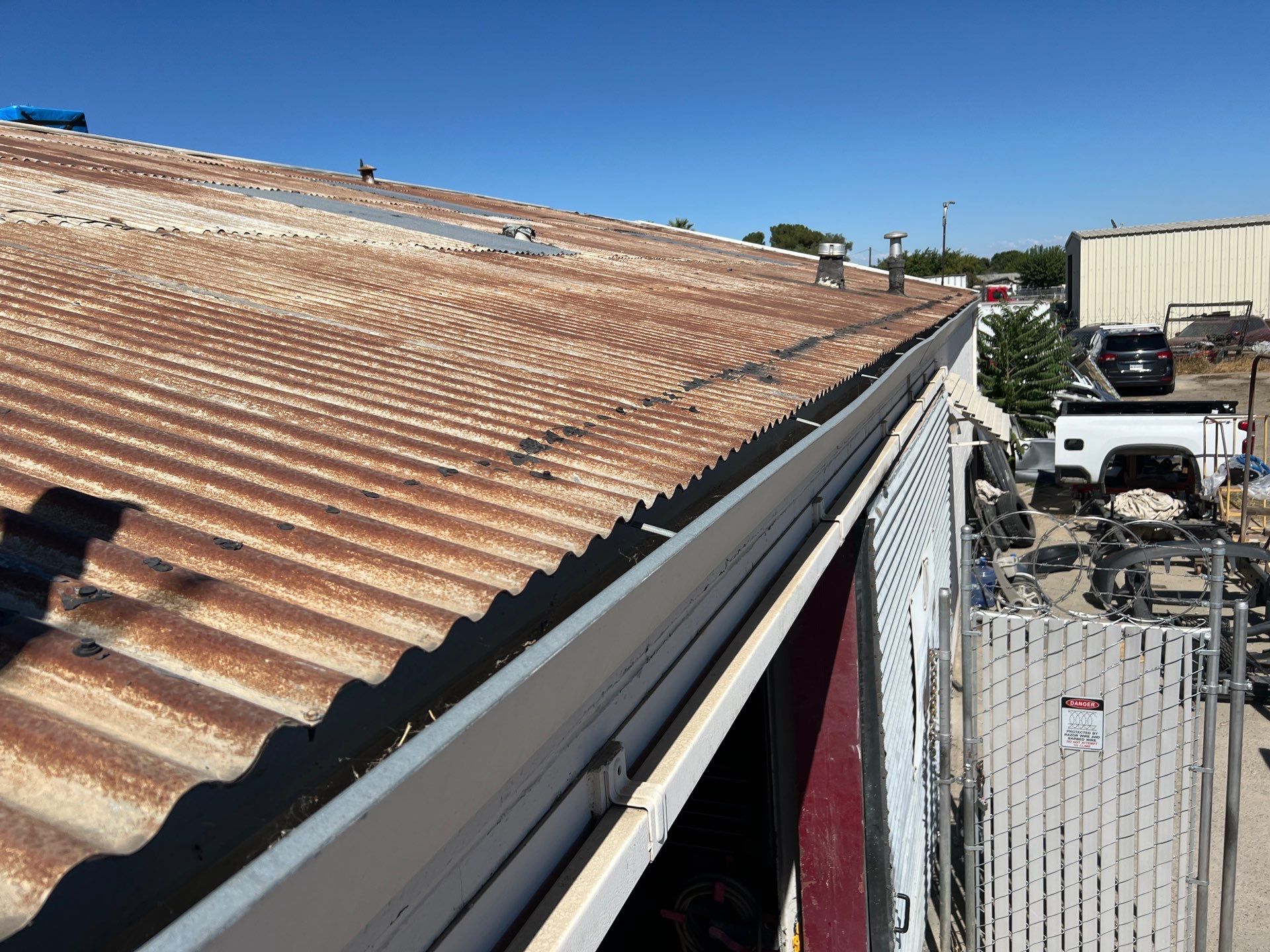Spray foam and coatings using Conklin Benchmark/ PUMA XL acrylic coatings over metal and foam by Straight Edge Roofing Inc