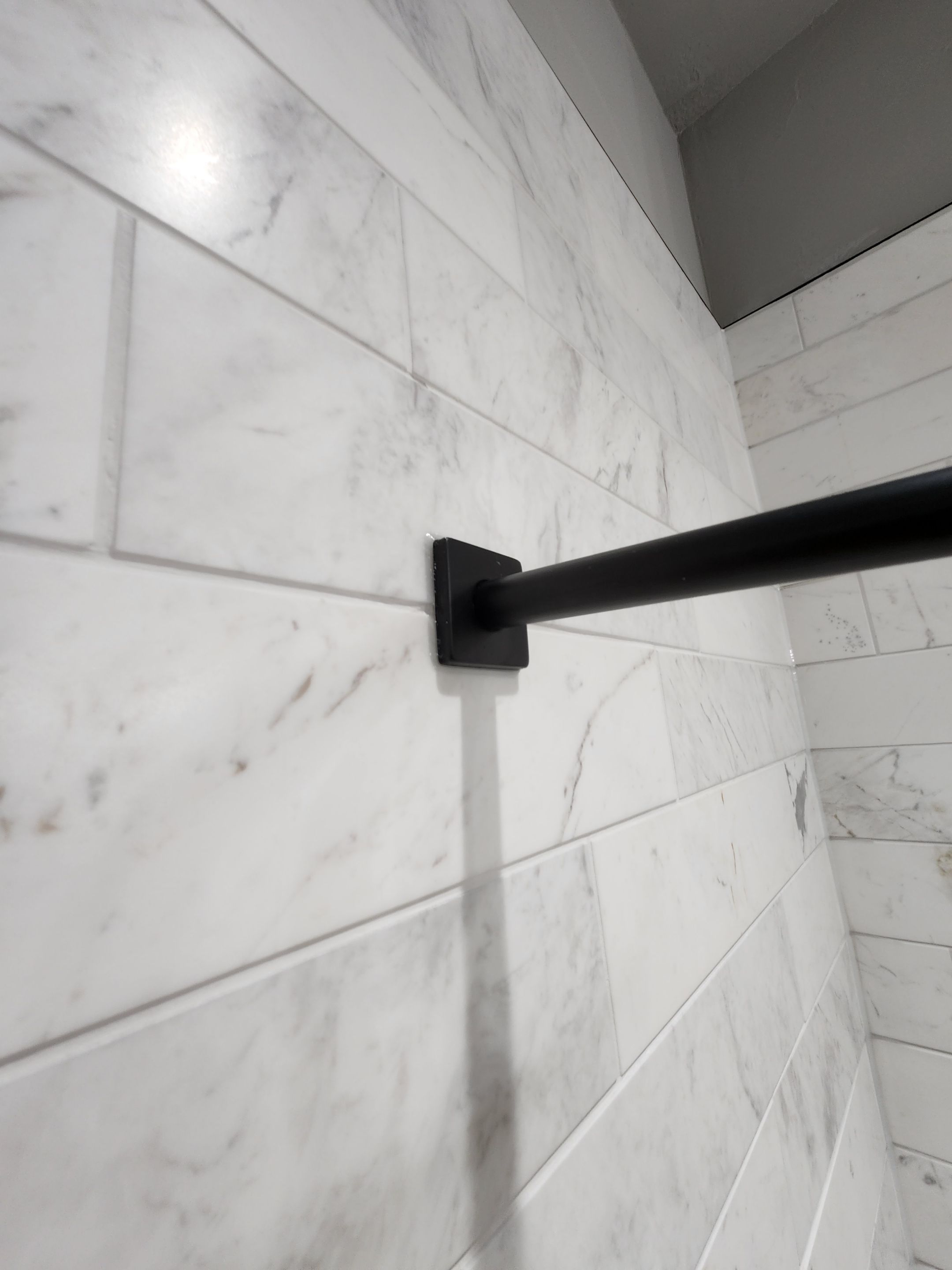 Spring Bathroom Remodel with Black Free-Standing Tub and Walk-In Shower by Legacy Bath and Kitchen