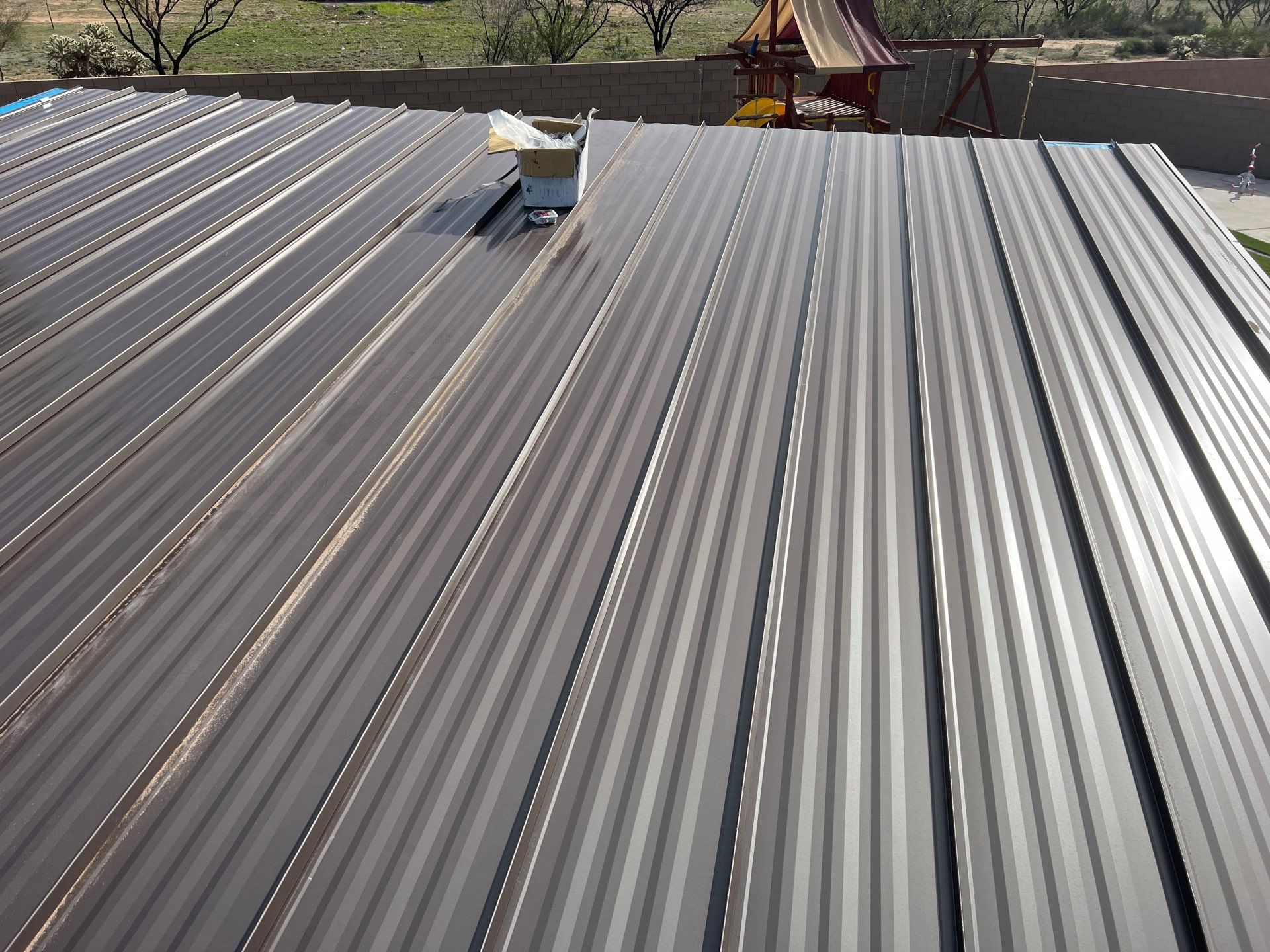 Dark Bronze Standing Seam by Reimagine Roofing