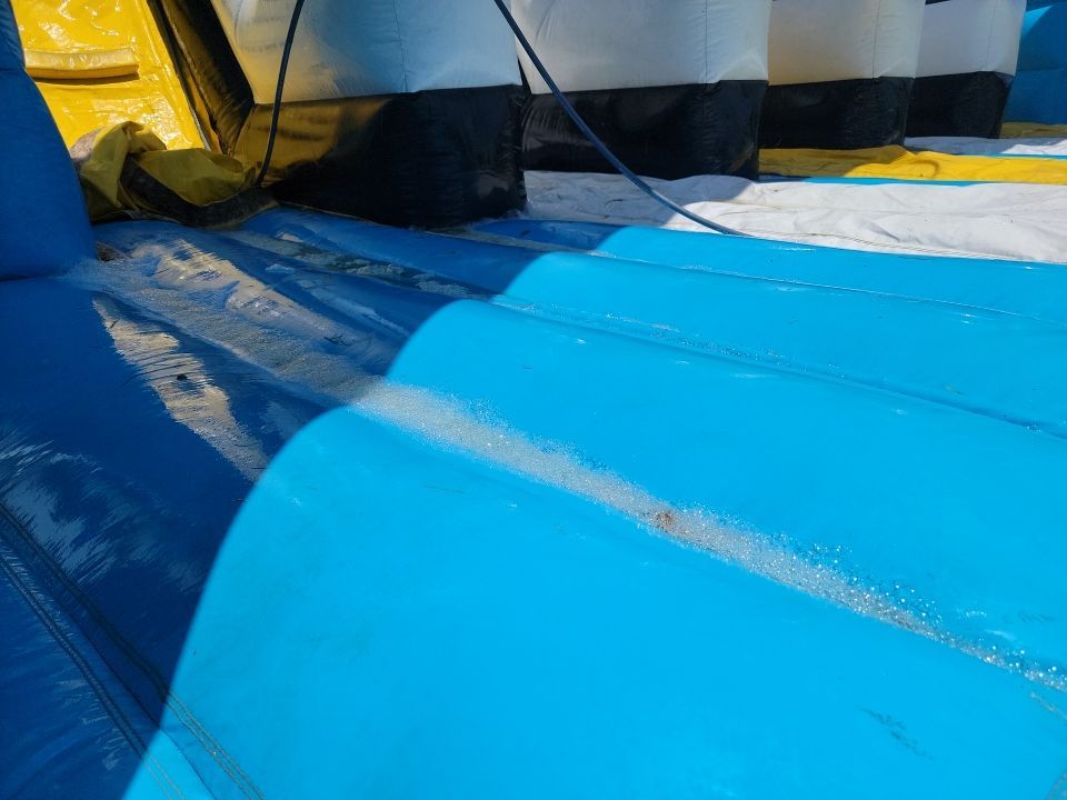 Cleaning for big bounce america prior to a large event by Northern Power Washing LLC.