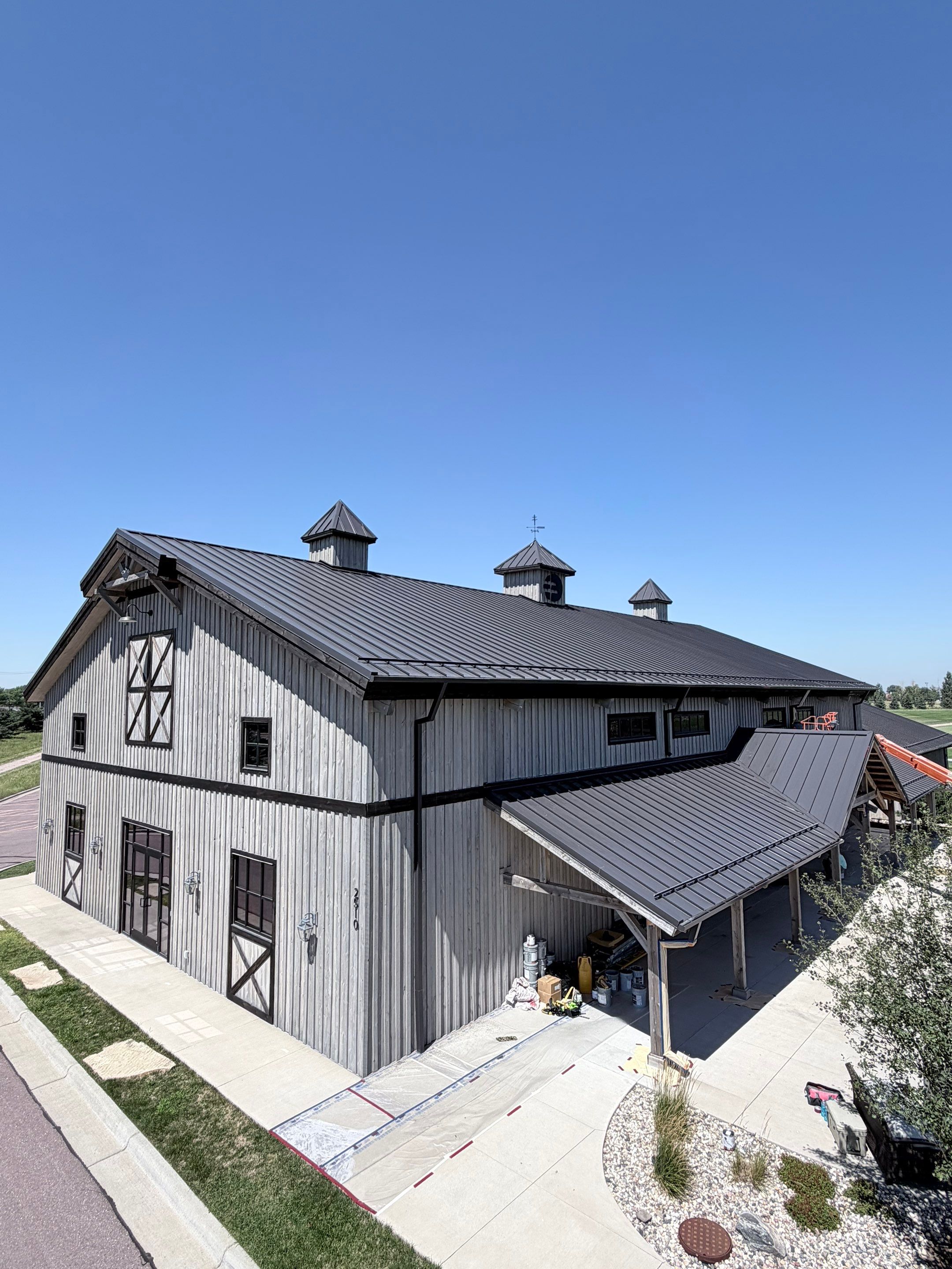 Commercial Exterior Wood Staining for Sanford Barn in Sioux Falls by Select Painting, Coatings & Garage Cabinets