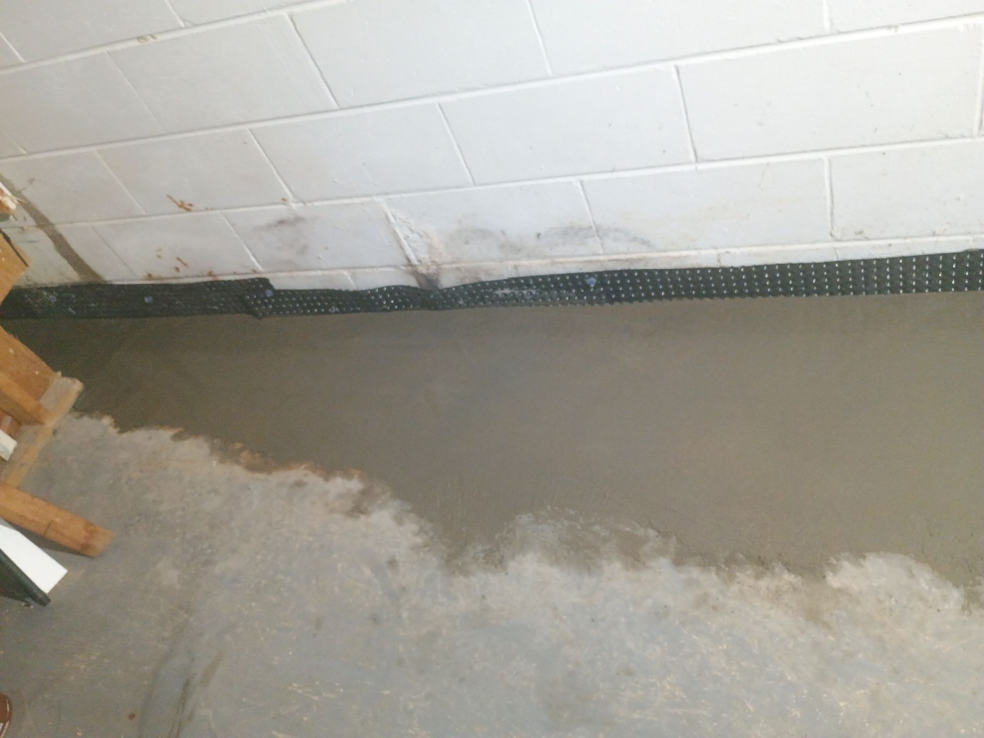 Interior Drain Tile Installation in Columbia Heights, MN by Waterproofing Northeast