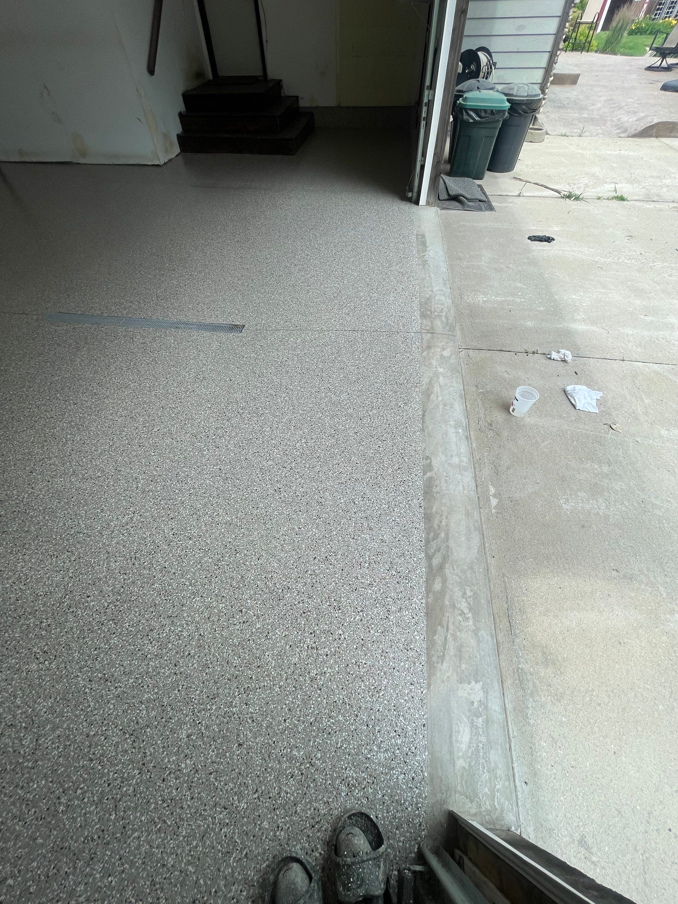 Hartford Residential Garage Floor Transformation With Decorative Chip Coating by Select Painting, Coatings & Garage Cabinets