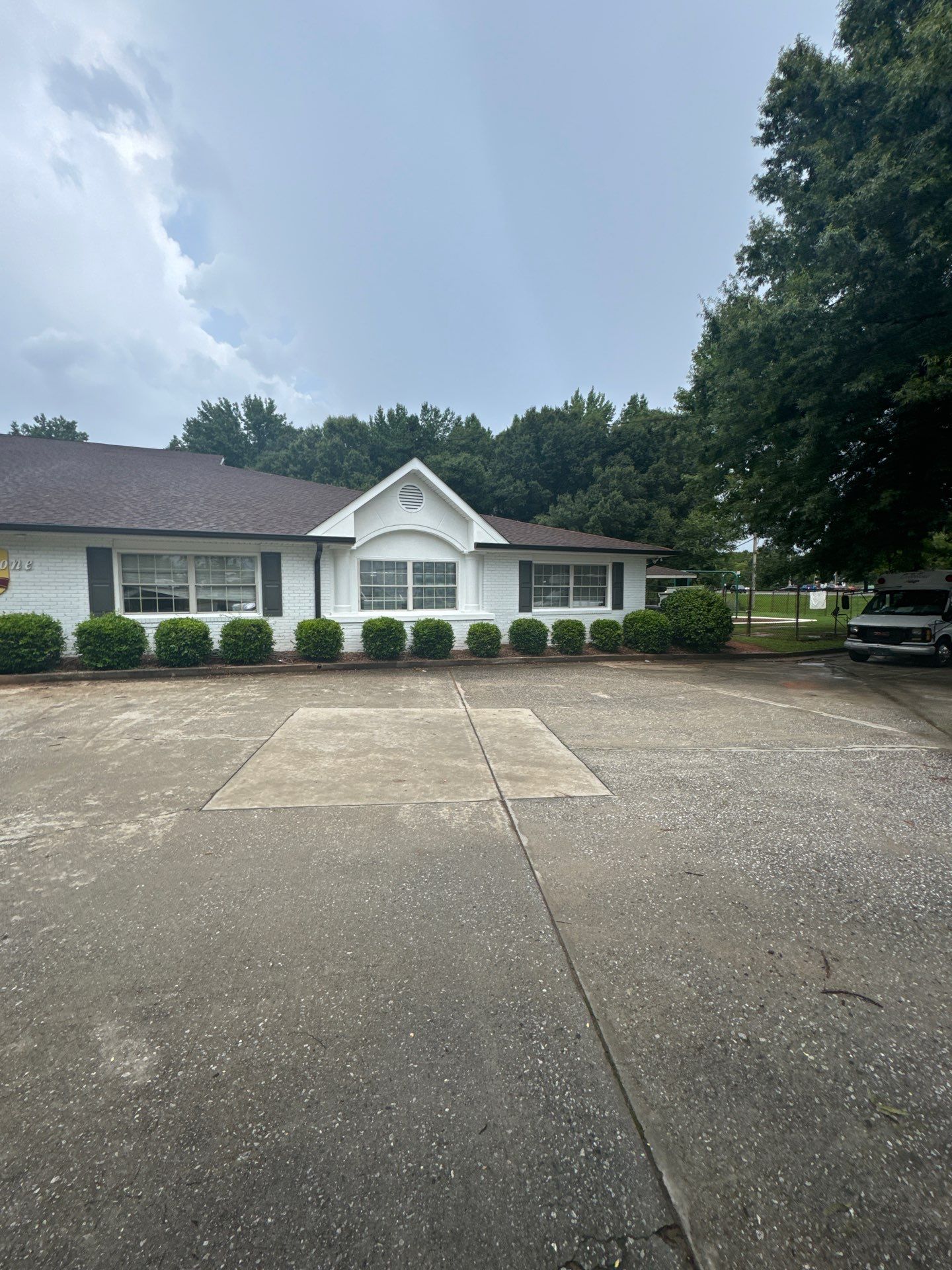 Commercial Exterior Brick and Stucco Painting in Fayetteville by Swift Home Renovations