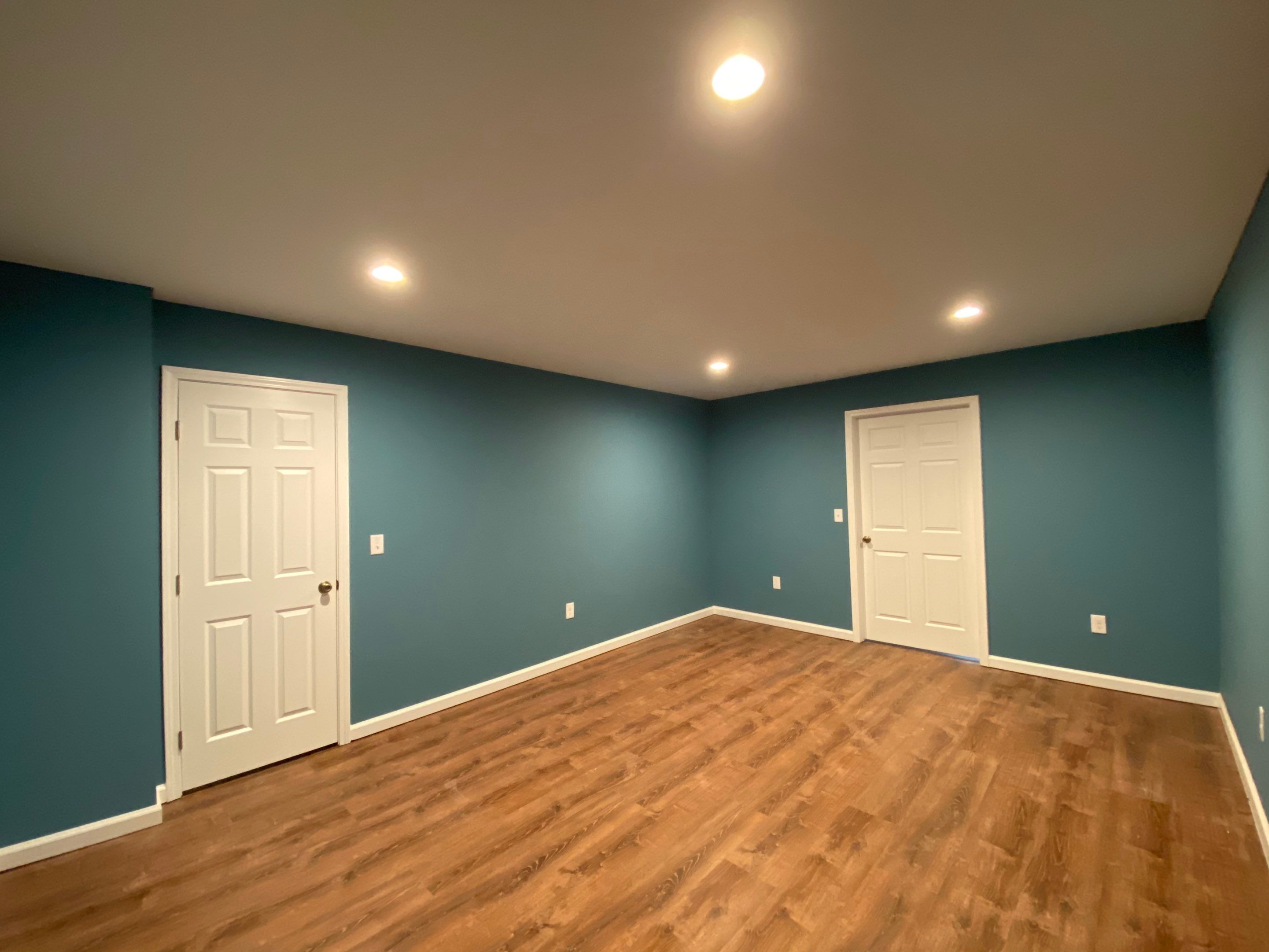 Finished Basement Transformation With Luxury Vinyl Plank Flooring in Acworth by Swift Home Renovations