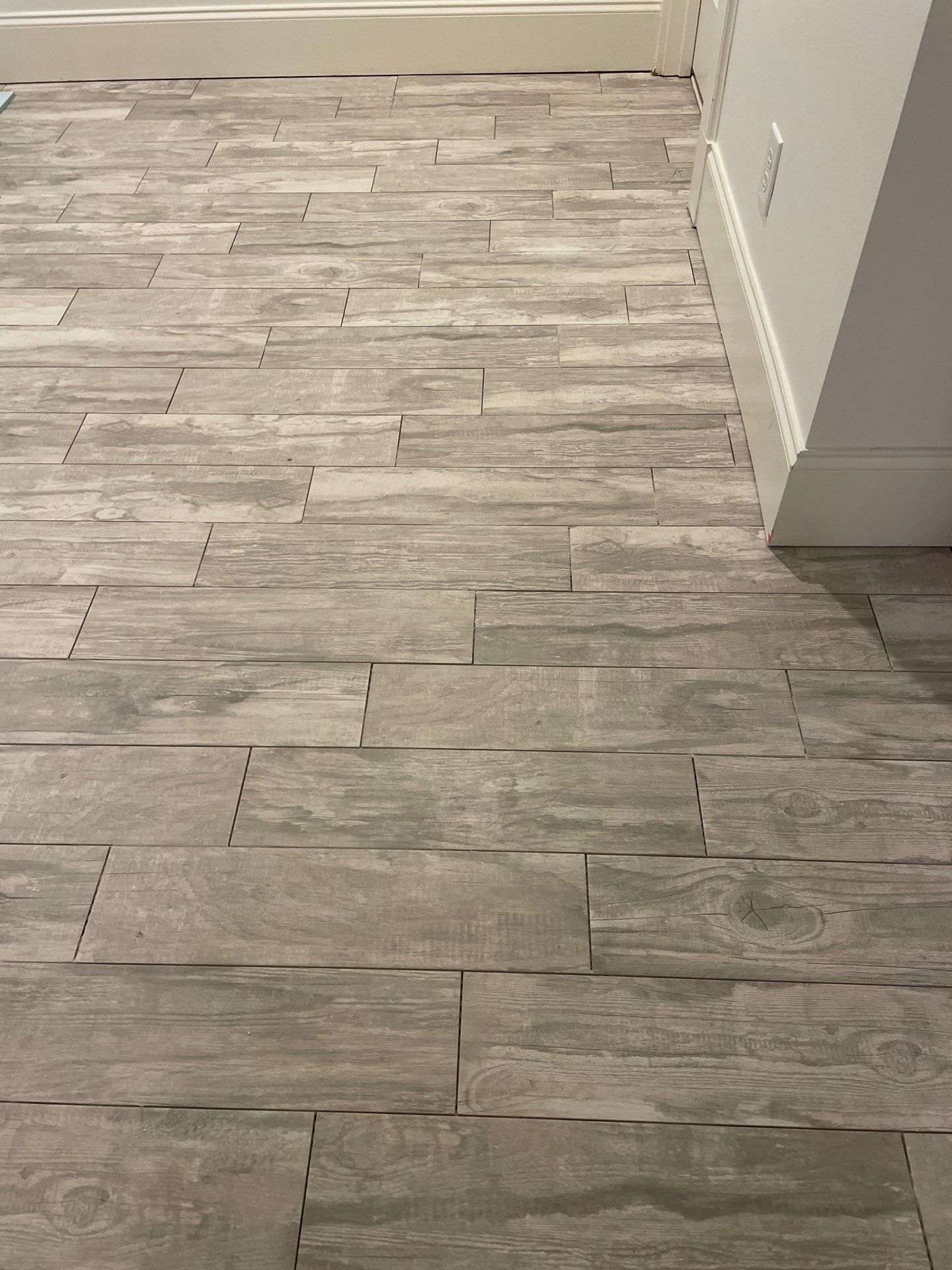 Herringbone and plank tile by Footprints Floors of East Atlanta