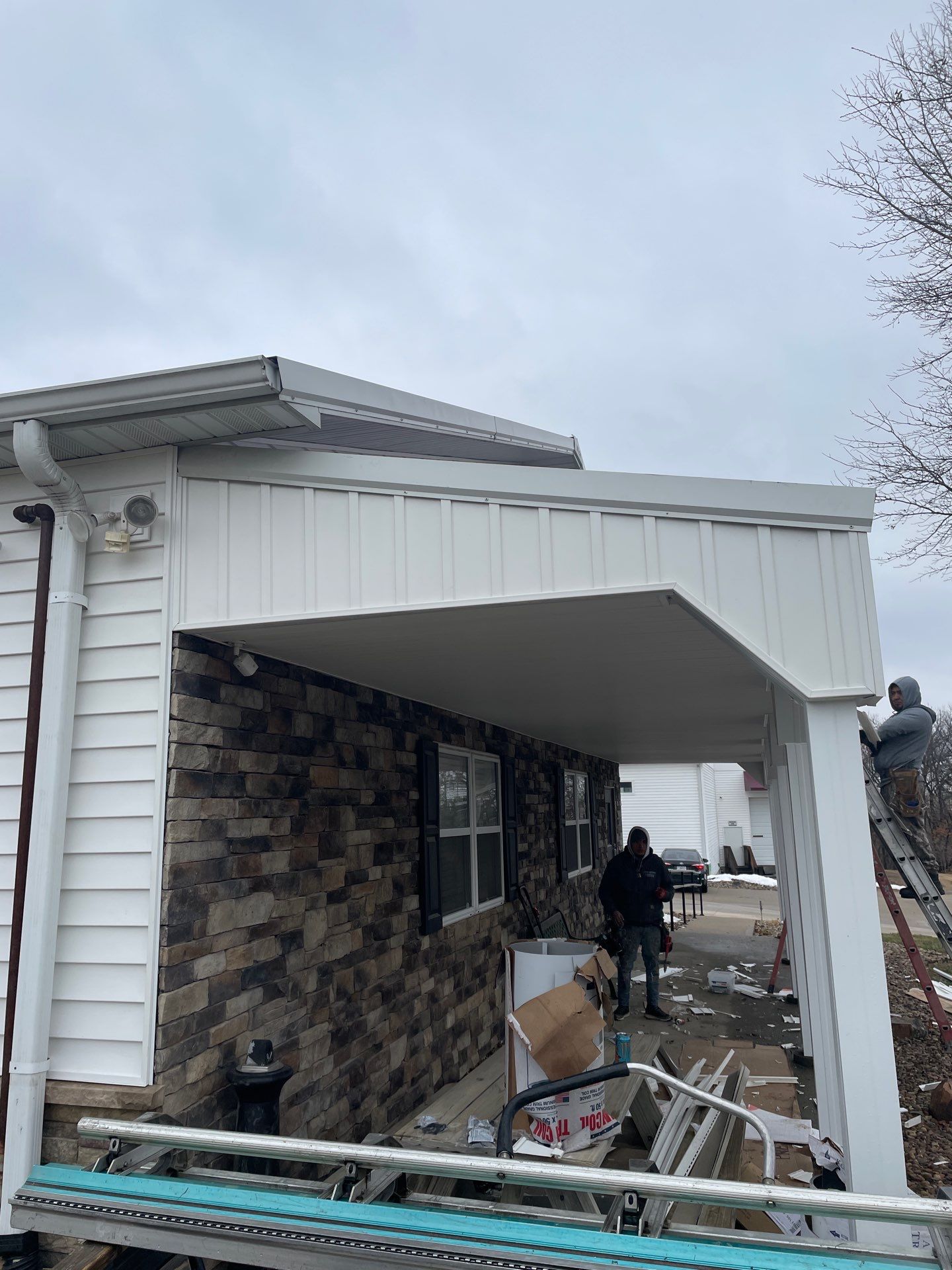 Siding and Stone Installation using Extrerior Porfolio Vinyl Siding and Versetta Stone by EEC  Windows, Siding & Roofing 