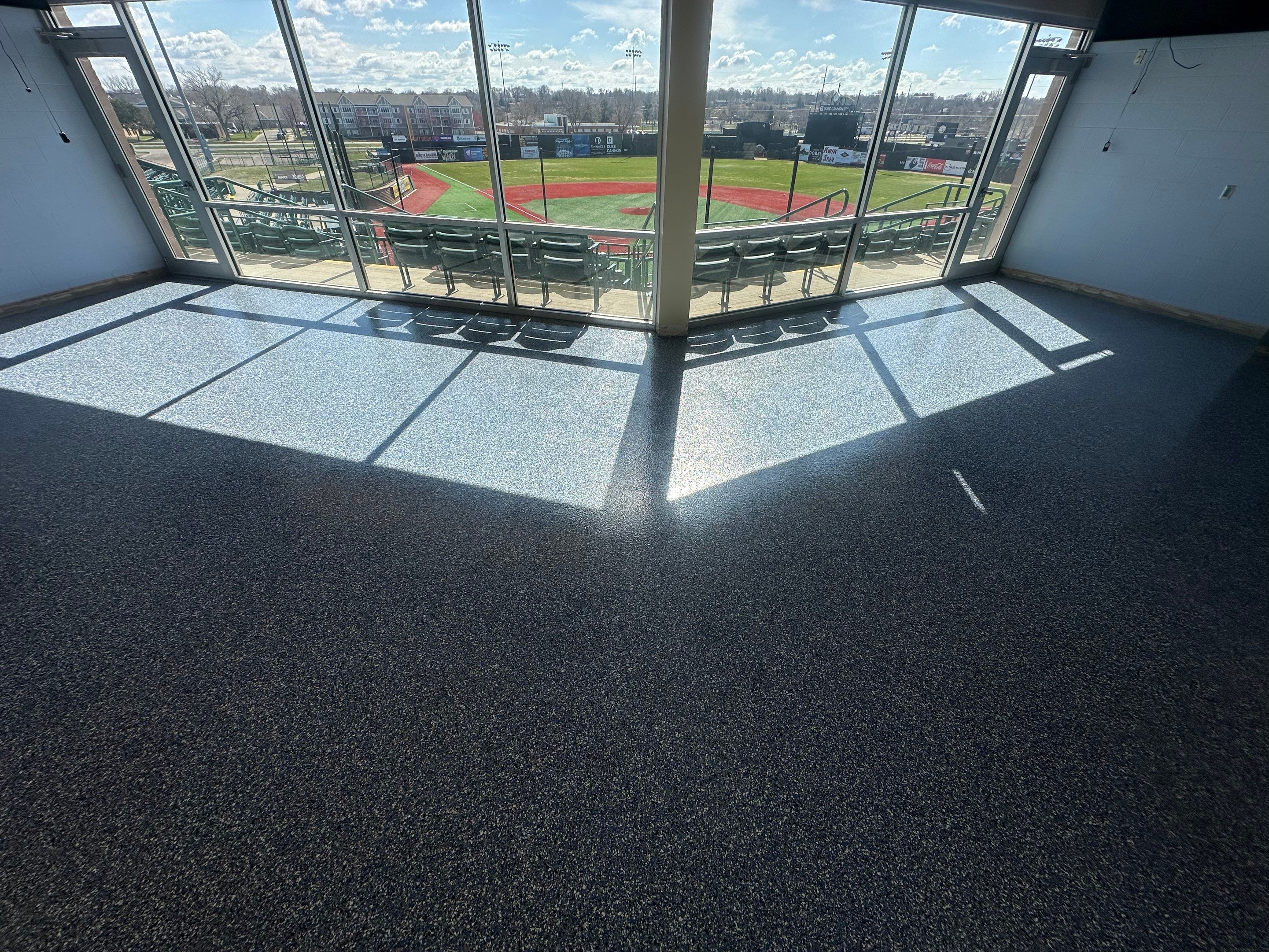 Commercial Epoxy Floor Coating for Stadium Viewing Suites in Sioux Falls by Select Painting, Coatings & Garage Cabinets