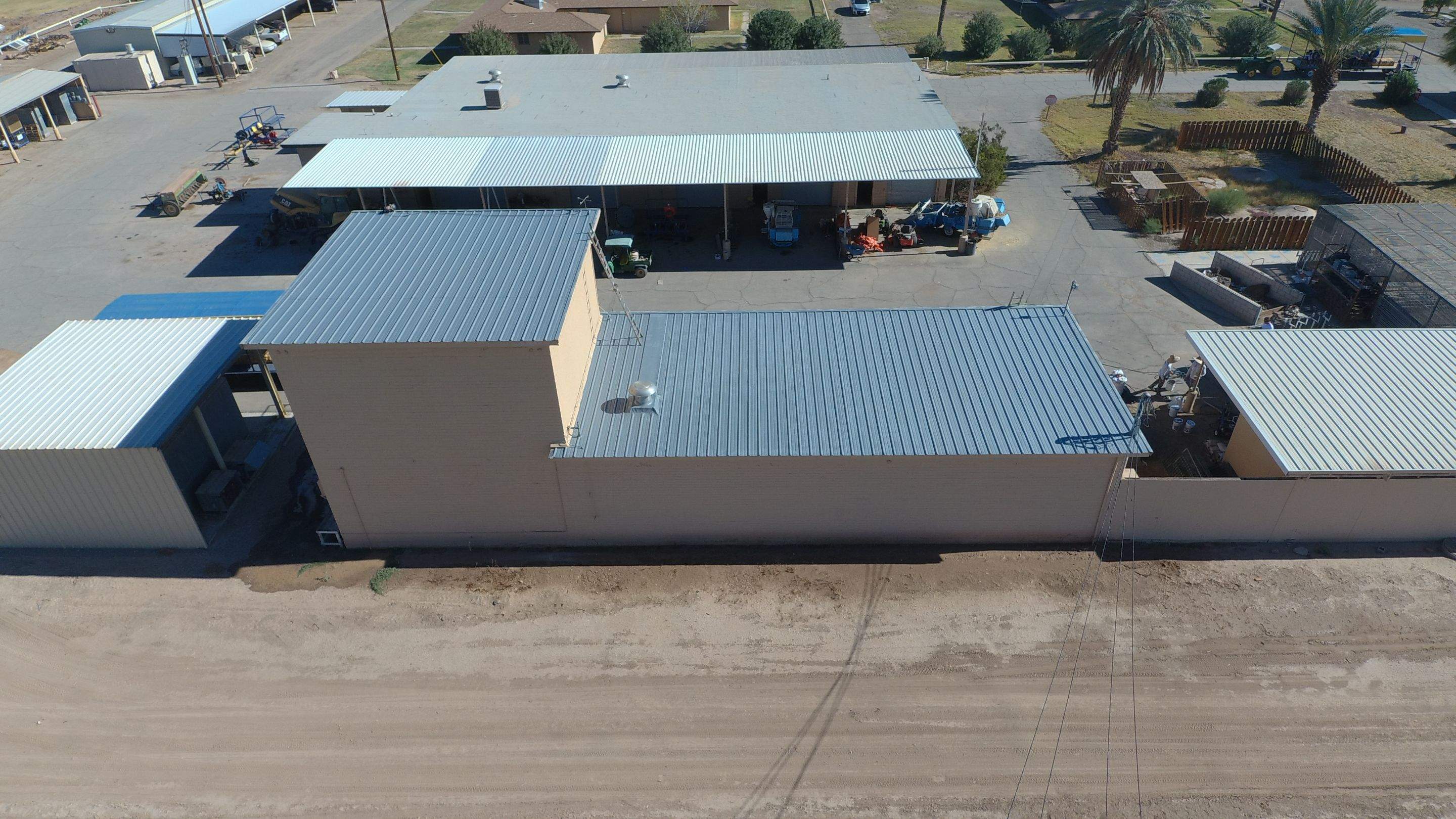 Metal roof restoration on commercial roof using Conklin Benchmark/PUMA XL fabric and coating by Straight Edge Roofing Inc