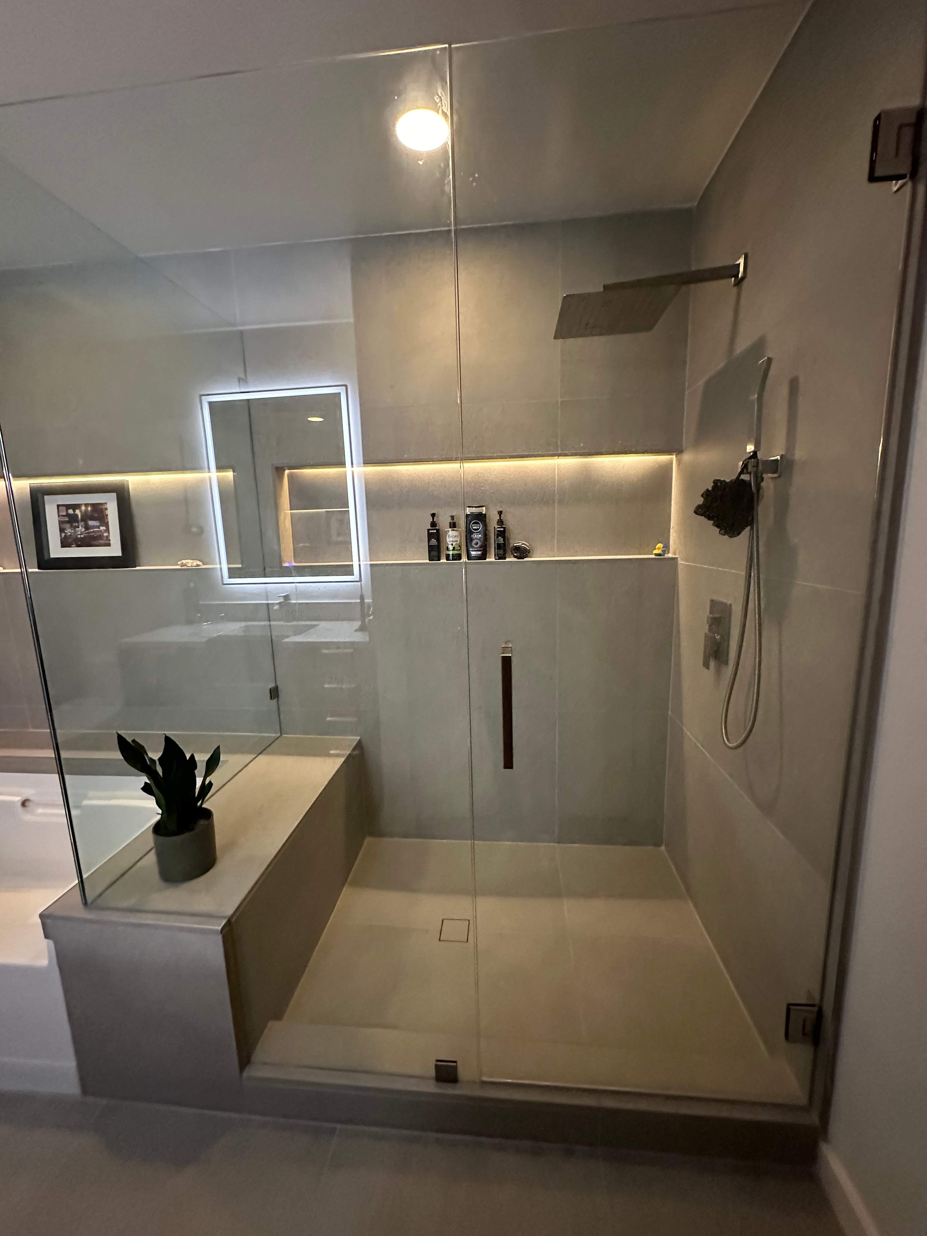 Modern Bathroom Transformation by Fine Line Flooring Inc.