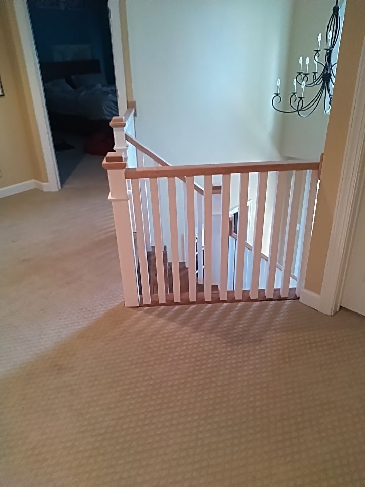 Stairway Installation using Red oak modern railings by House Custom Carpentry, LLC