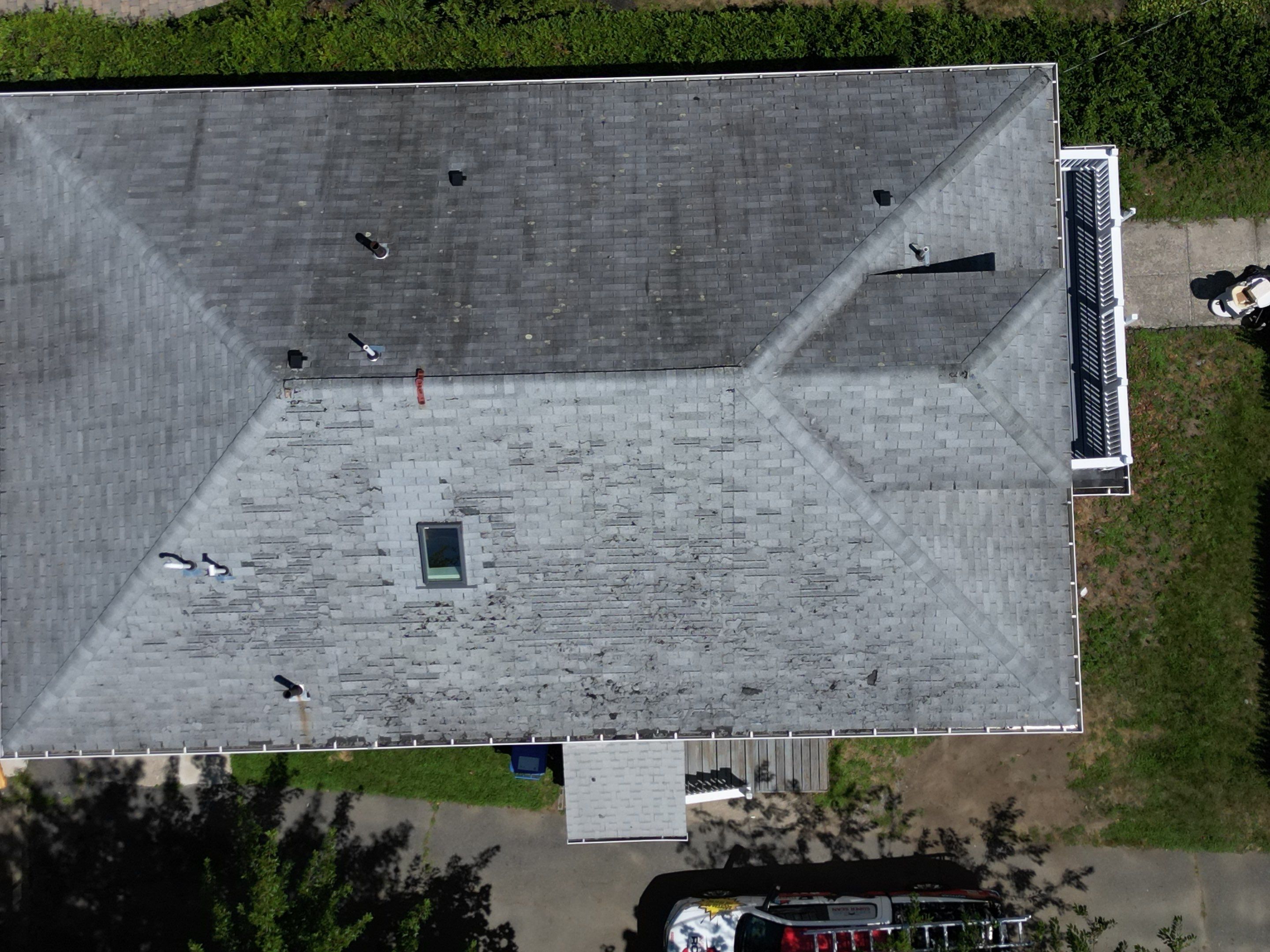Roof Replacement with Skylight Flashing in Waltham, MA by Mighty Dog Roofing of Greater Middlesex County
