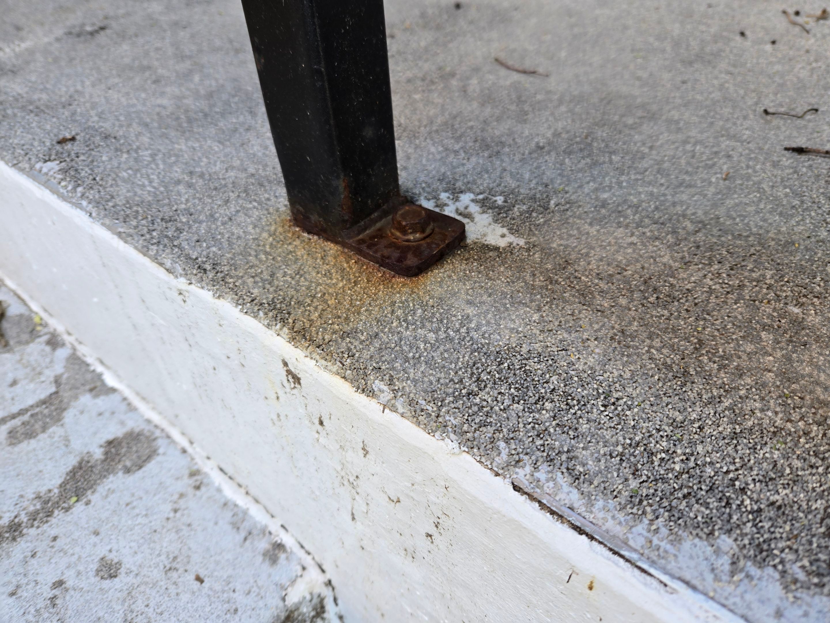 Grey Polyaspartic Porch and Stair Resurfacing in Sioux Falls by Select Painting, Coatings & Garage Cabinets