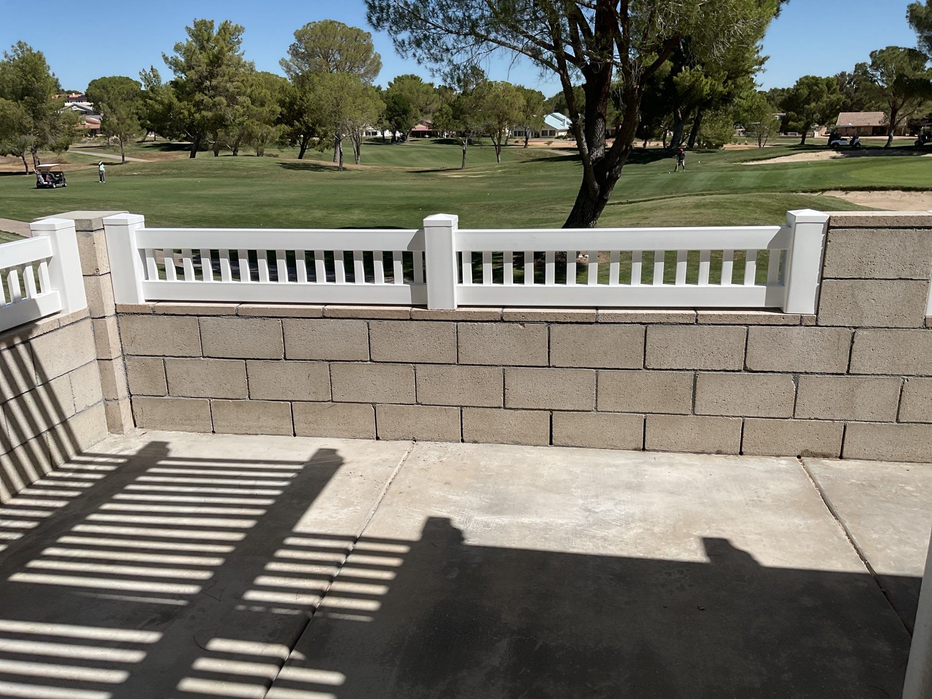 White Box Picket Fence on top of block wall  by Fence Guys Inc. 