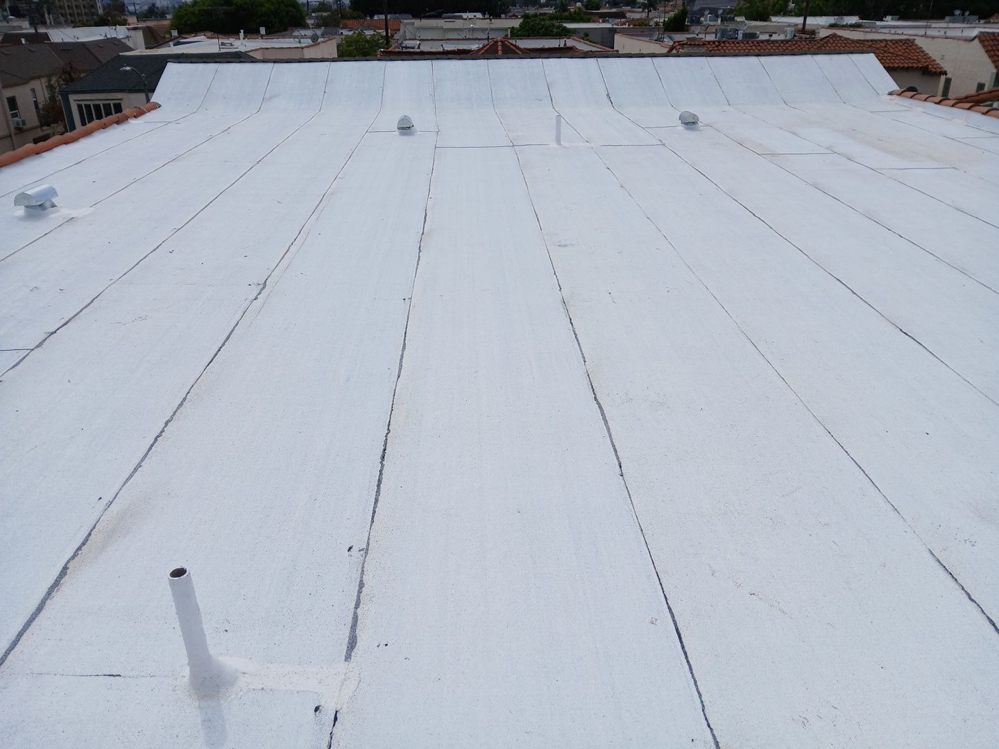 Apartment Building Reroofing using Polyfresko® G Highly Reflective Modified Bitumen Cap Sheet by Hull Brothers Roofing