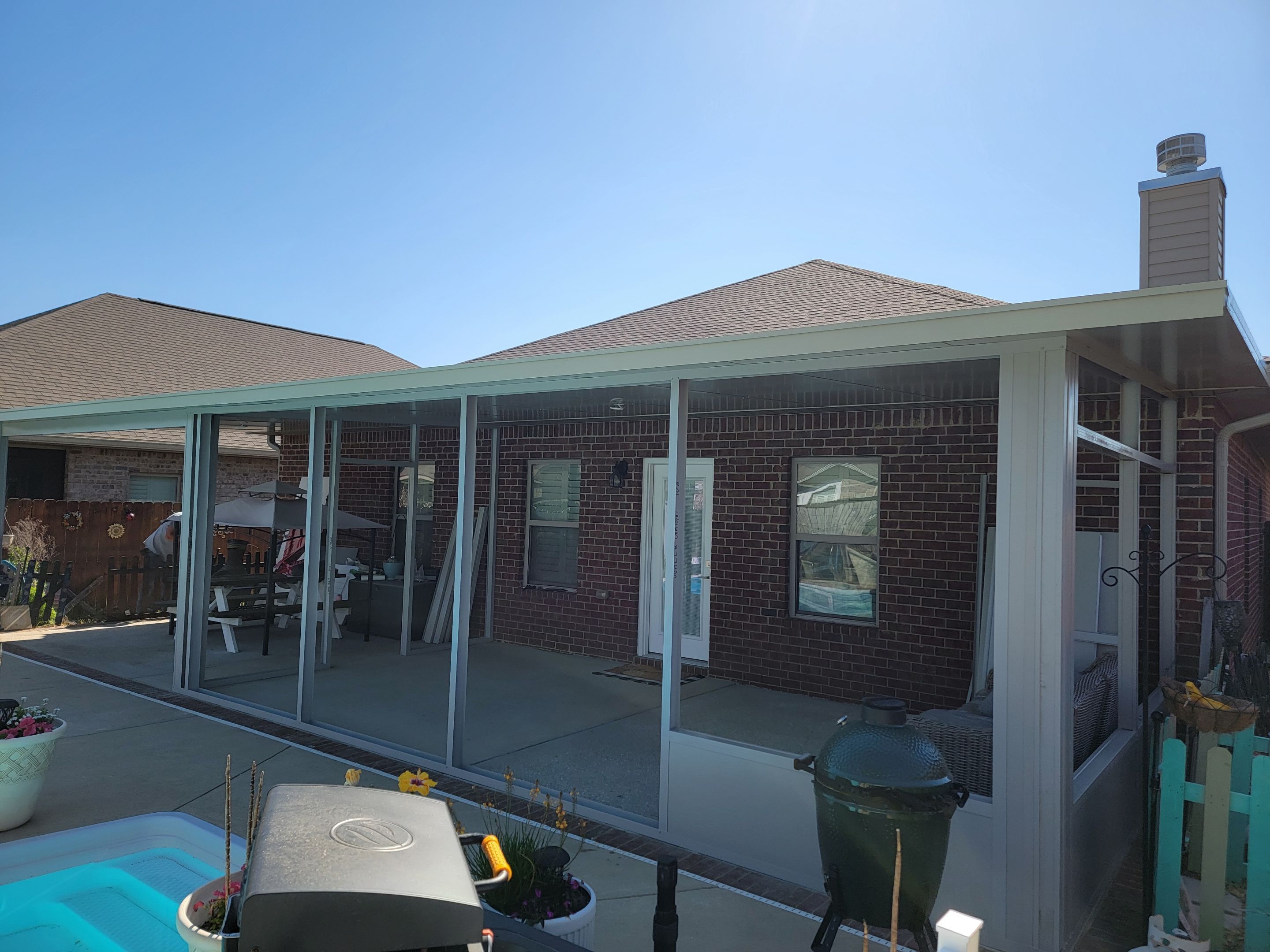 Poolside Screen Room & Patio Cover in Gulf Breeze by Titan Sunrooms