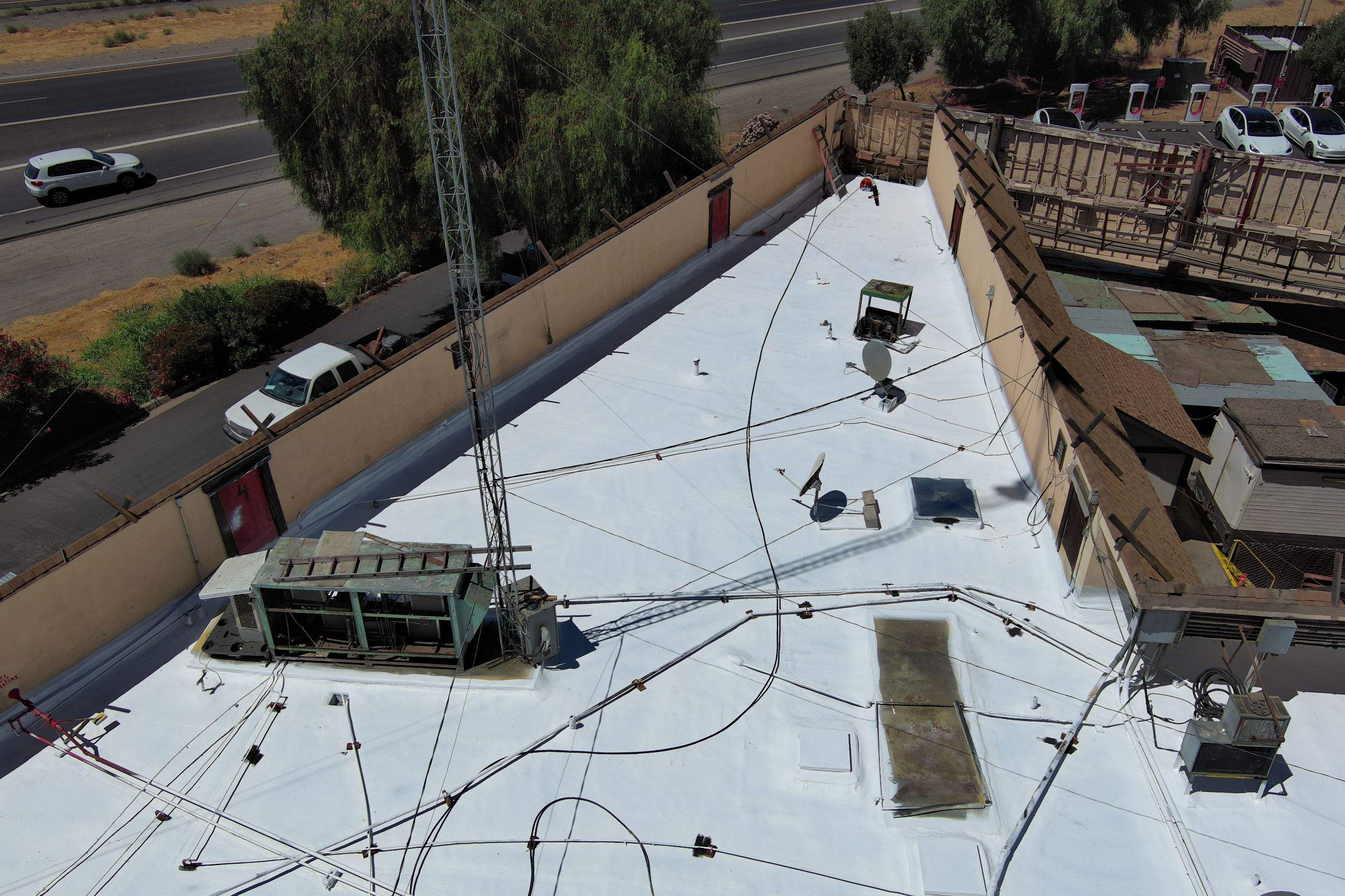 Spray foam and coatings using General Coatings acrylic coatings and spray foam by Straight Edge Roofing Inc