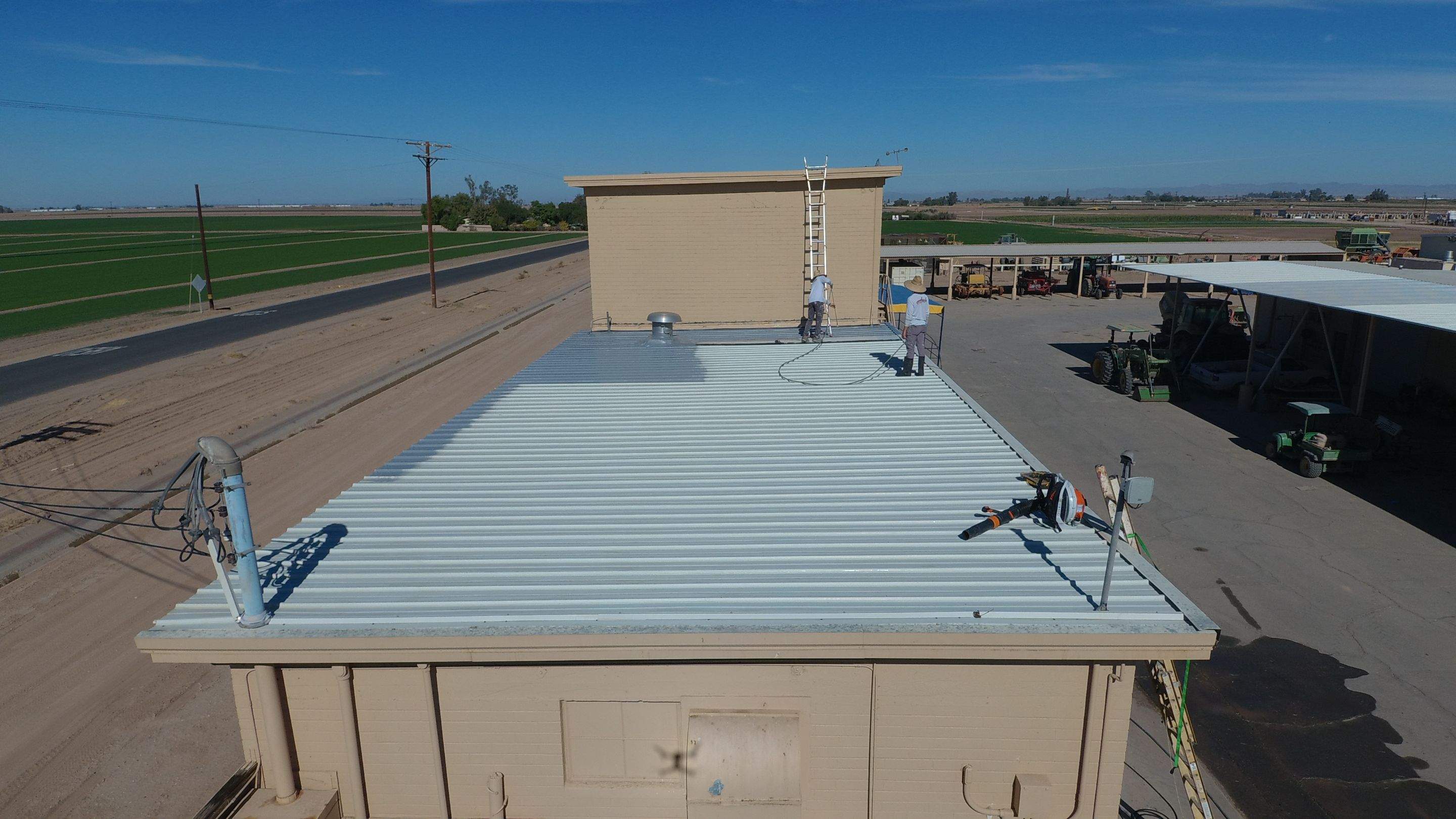 Metal roof restoration on commercial roof using Conklin Benchmark/PUMA XL fabric and coating by Straight Edge Roofing Inc