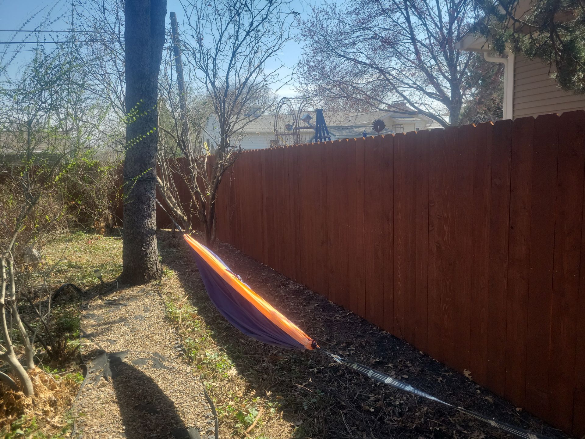 Stained Cedar Wood Privacy Fence Installation in Cedar Falls by Perfect Picket Fence and Stain