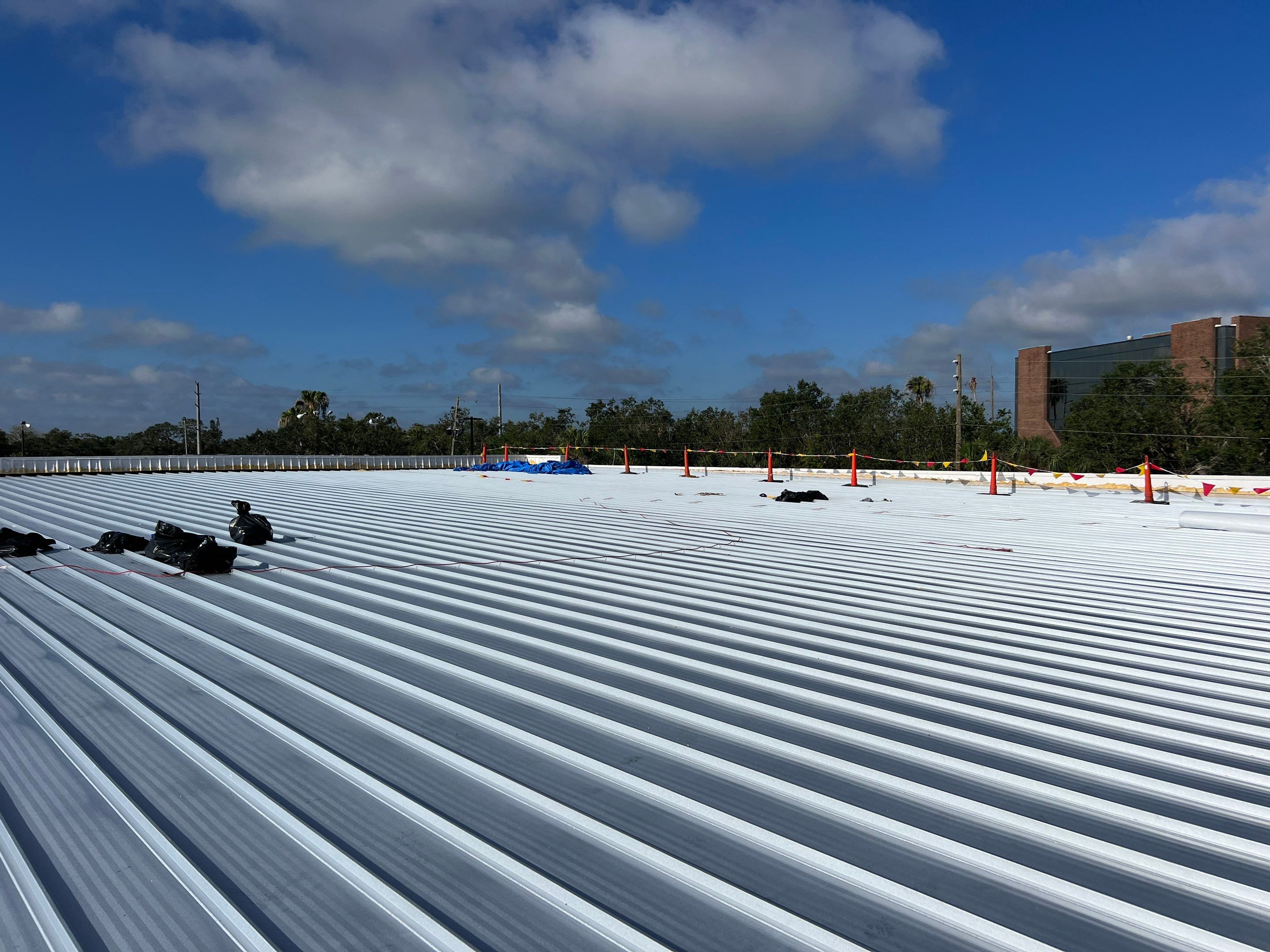 Commercial Metal Roof Replacement at Shopping Plaza in Port Charlotte by CES Roofing