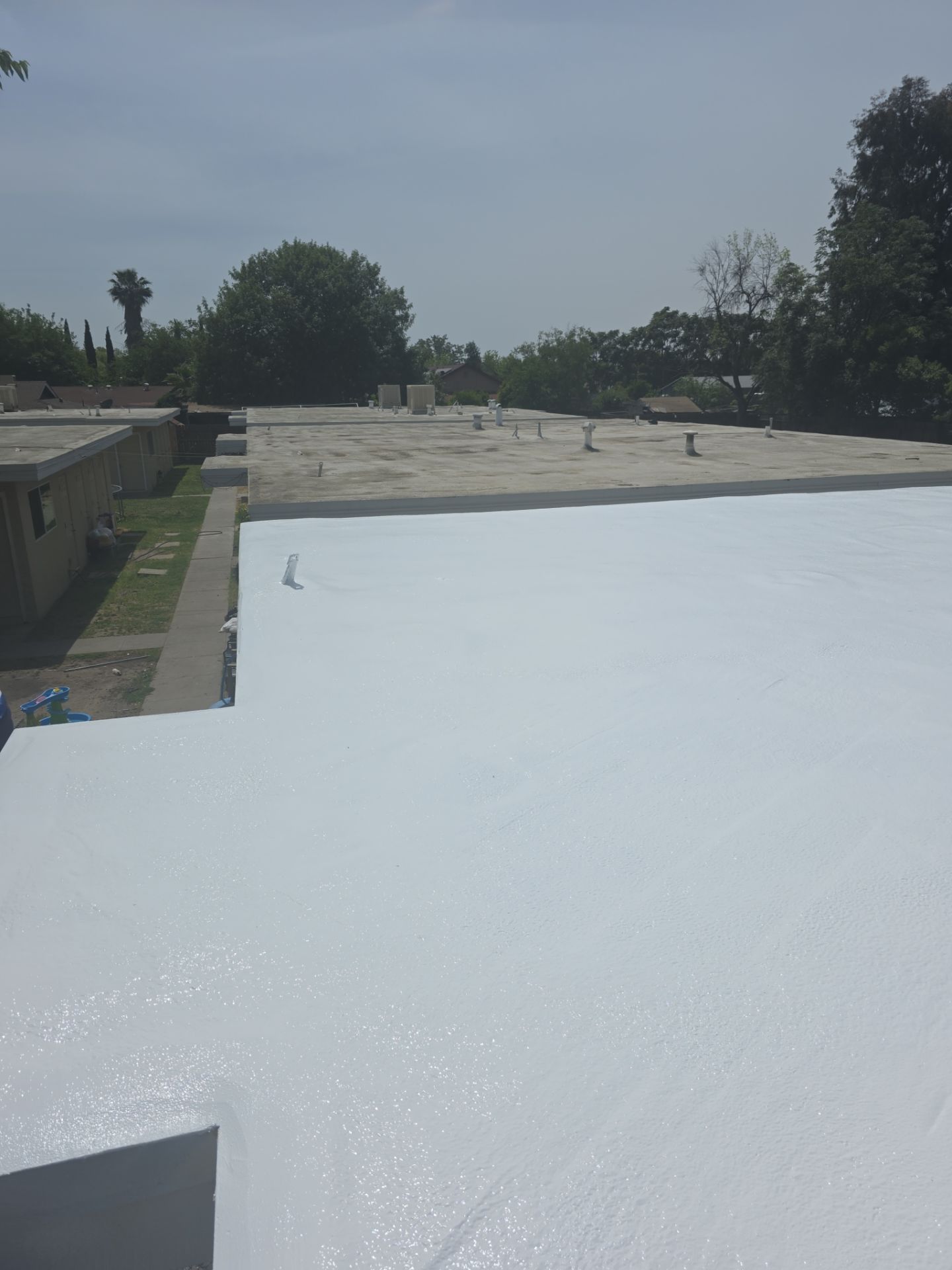 Foam Refurbish using Conklin Benchmark/PUMA XL coatings and spray foam by Straight Edge Roofing Inc