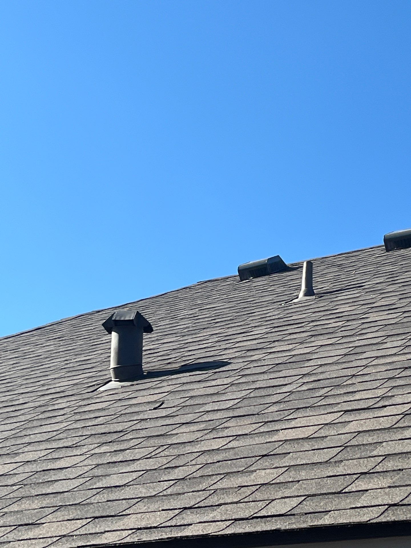 IKO Cornerstone-Dark Reddish Brown brick house  by Tejas Roofworks + Restoration