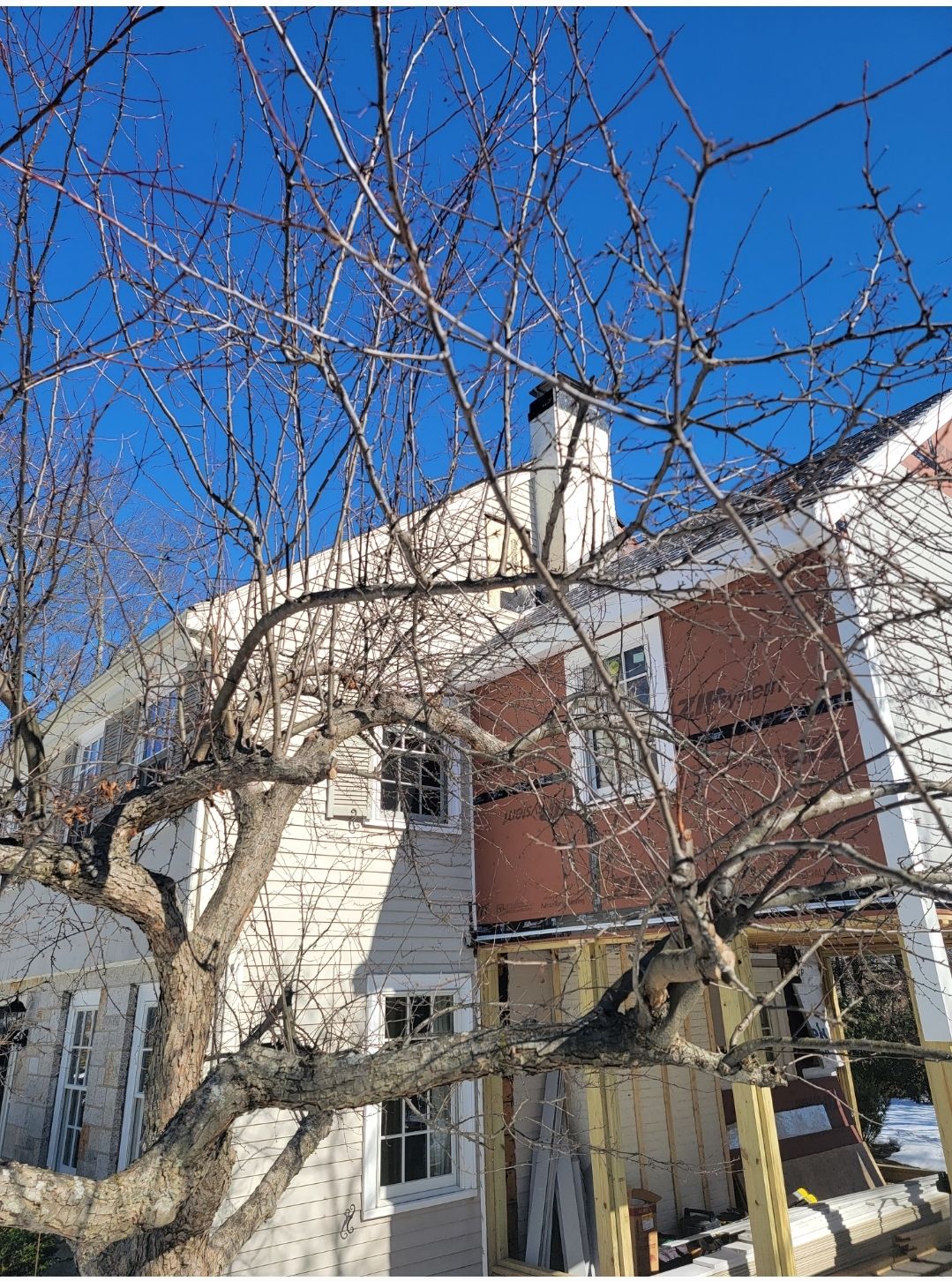 Wood Clapboards and vinyl Slate roof with new Pella windows in Wellesley. by UBrothers Construction