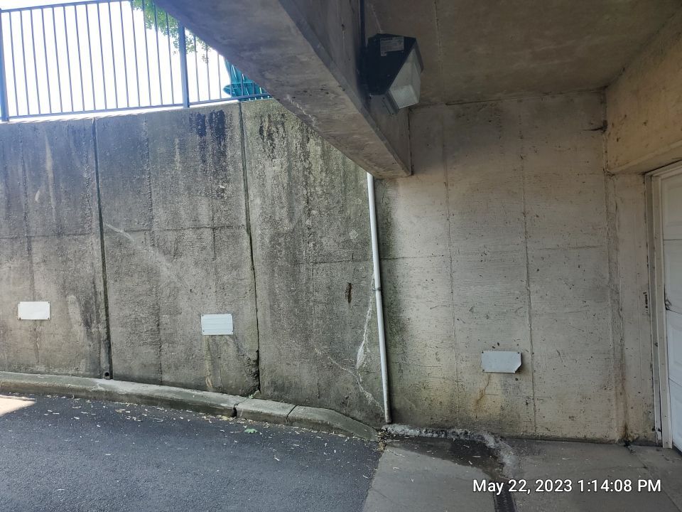 Parking garage using Hot water by Northern Power Washing LLC.